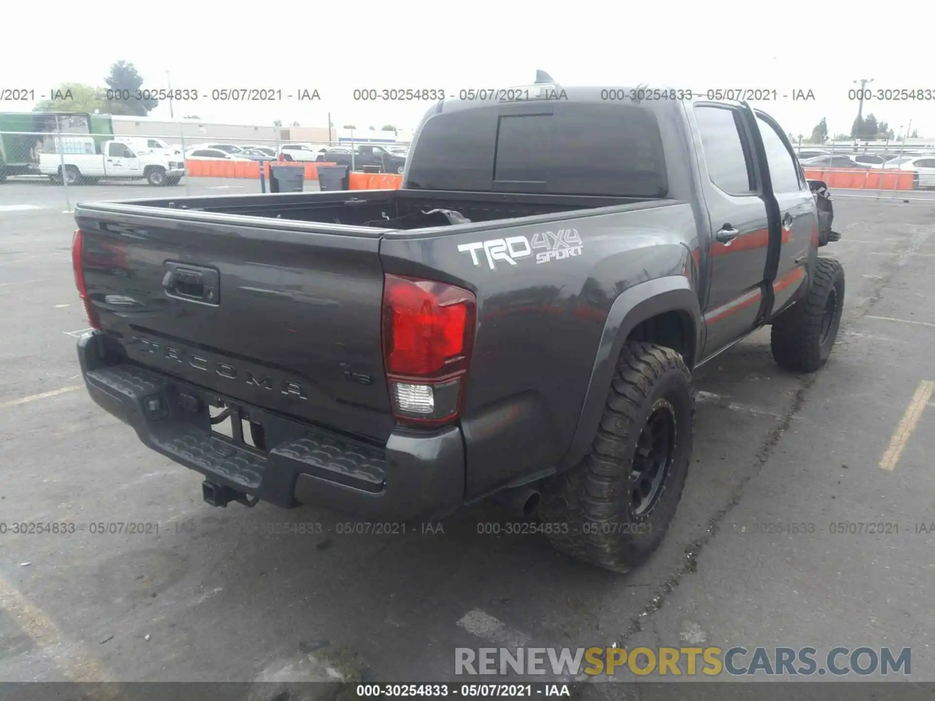 4 Photograph of a damaged car 3TMCZ5AN1KM275337 TOYOTA TACOMA 4WD 2019