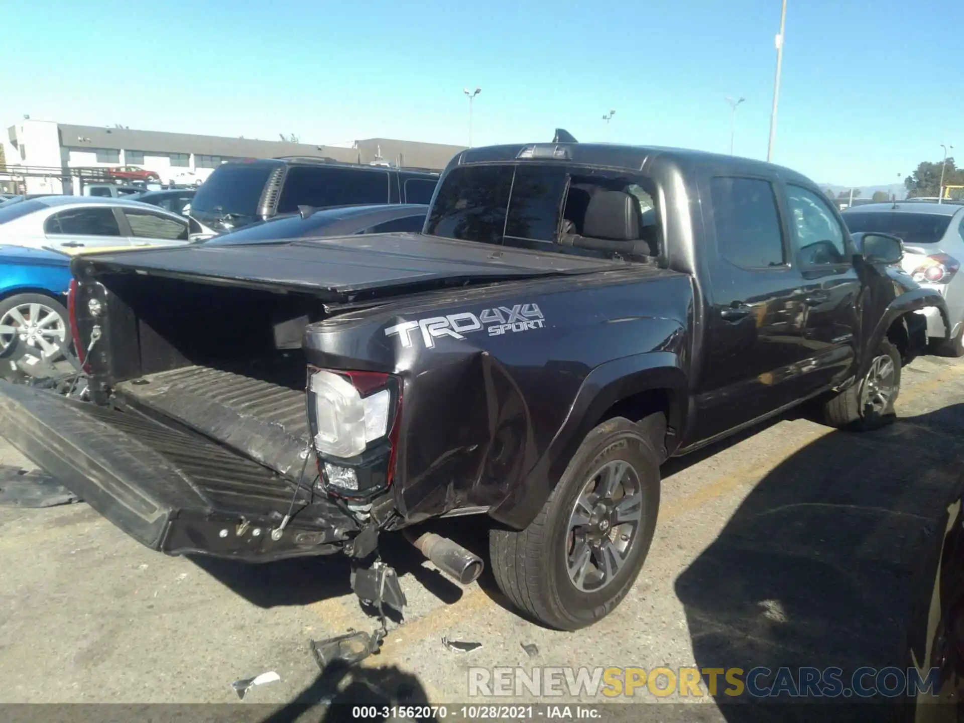 4 Photograph of a damaged car 3TMCZ5AN3KM236894 TOYOTA TACOMA 4WD 2019