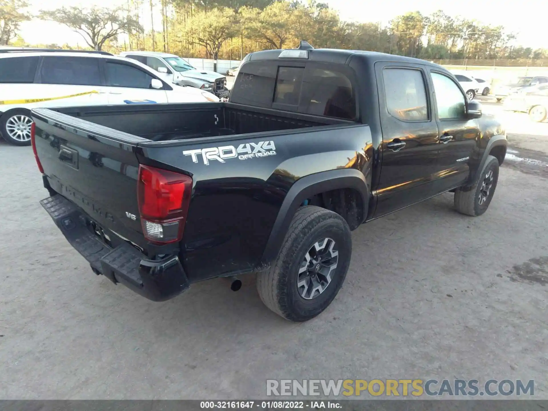 4 Photograph of a damaged car 3TMCZ5AN5KM223029 TOYOTA TACOMA 4WD 2019