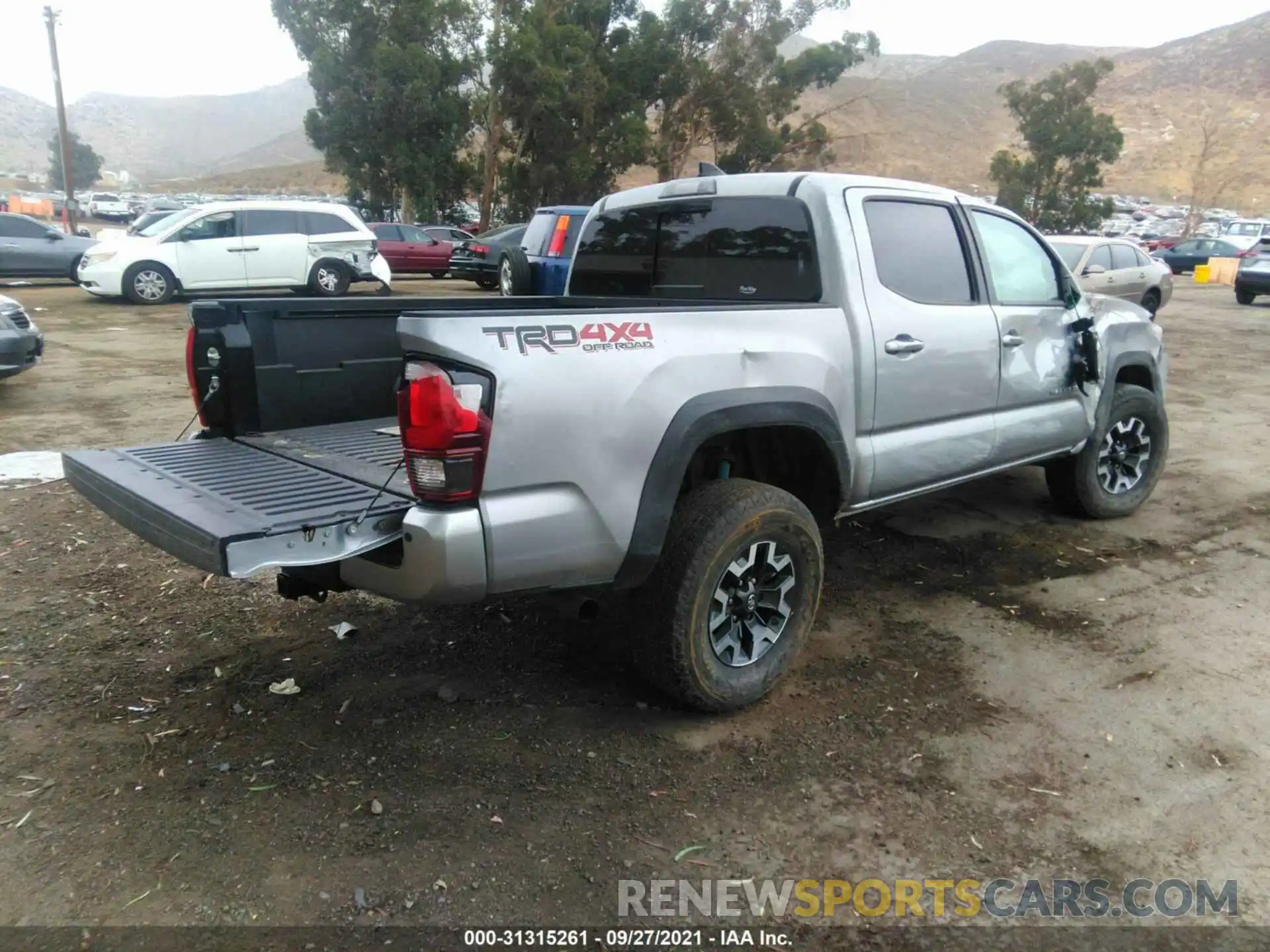 4 Photograph of a damaged car 3TMCZ5AN5KM259223 TOYOTA TACOMA 4WD 2019