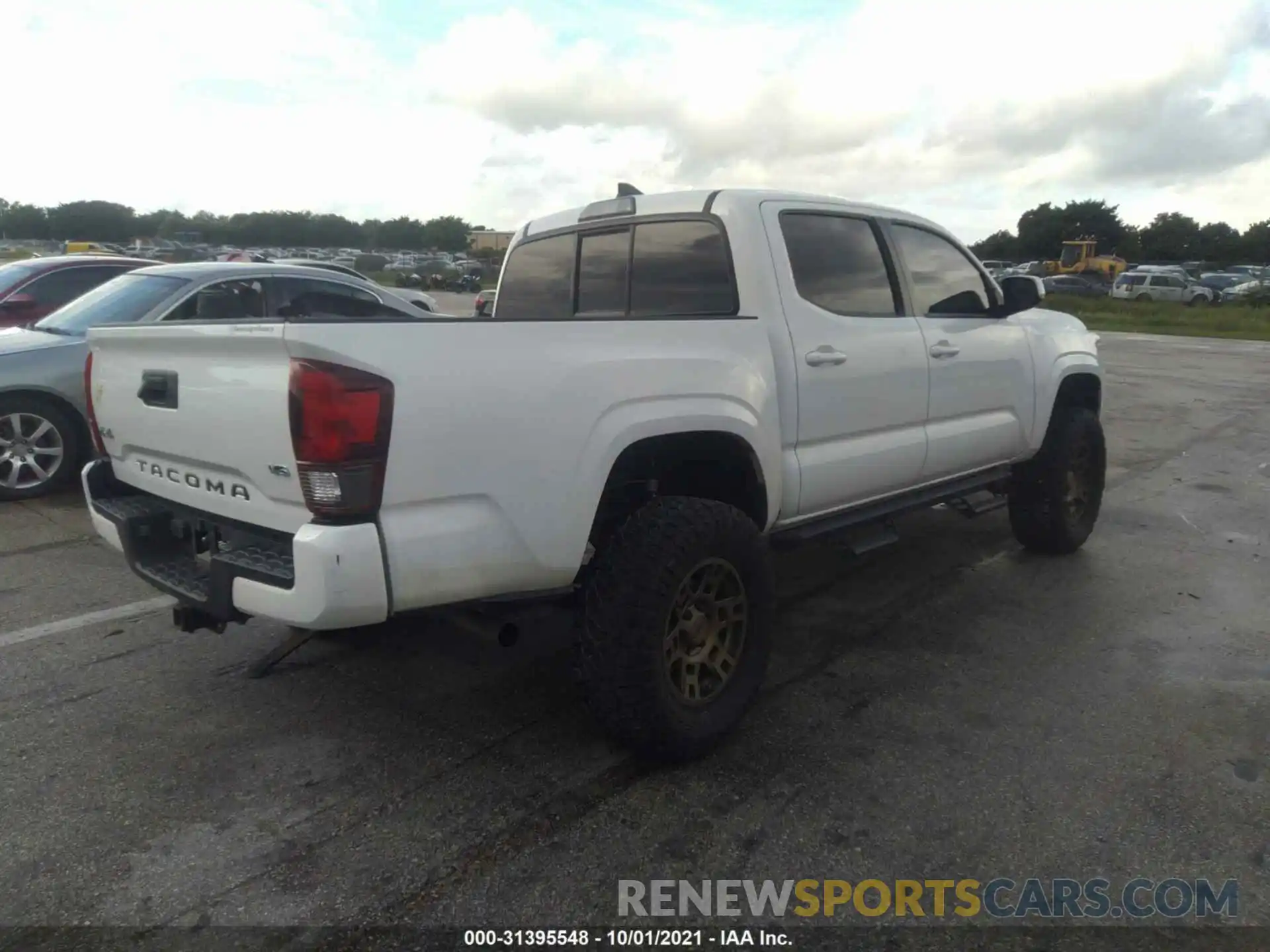 4 Photograph of a damaged car 3TMCZ5AN7KM256565 TOYOTA TACOMA 4WD 2019