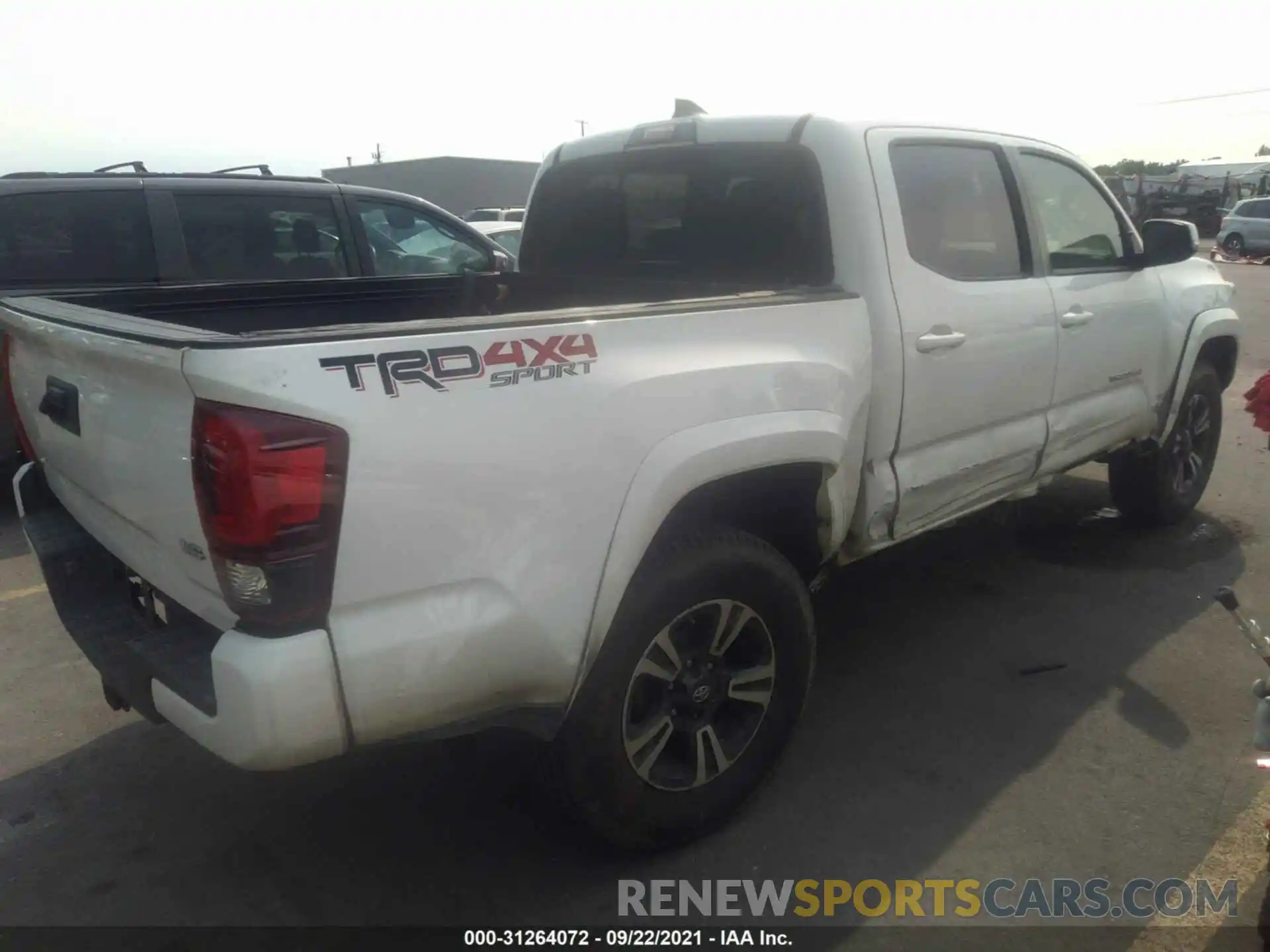 4 Photograph of a damaged car 3TMCZ5AN9KM197728 TOYOTA TACOMA 4WD 2019