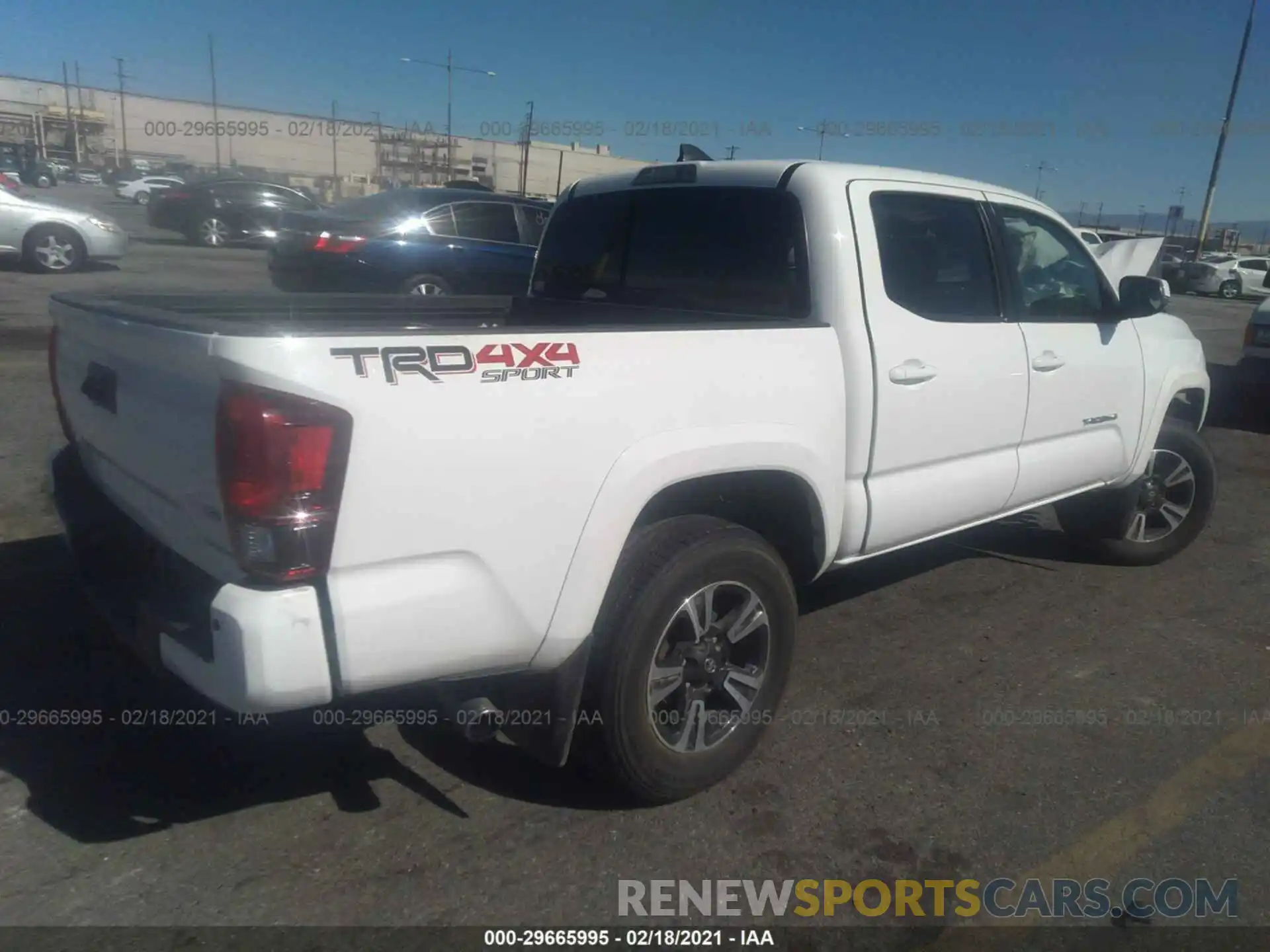 4 Photograph of a damaged car 3TMCZ5AN9KM211241 TOYOTA TACOMA 4WD 2019