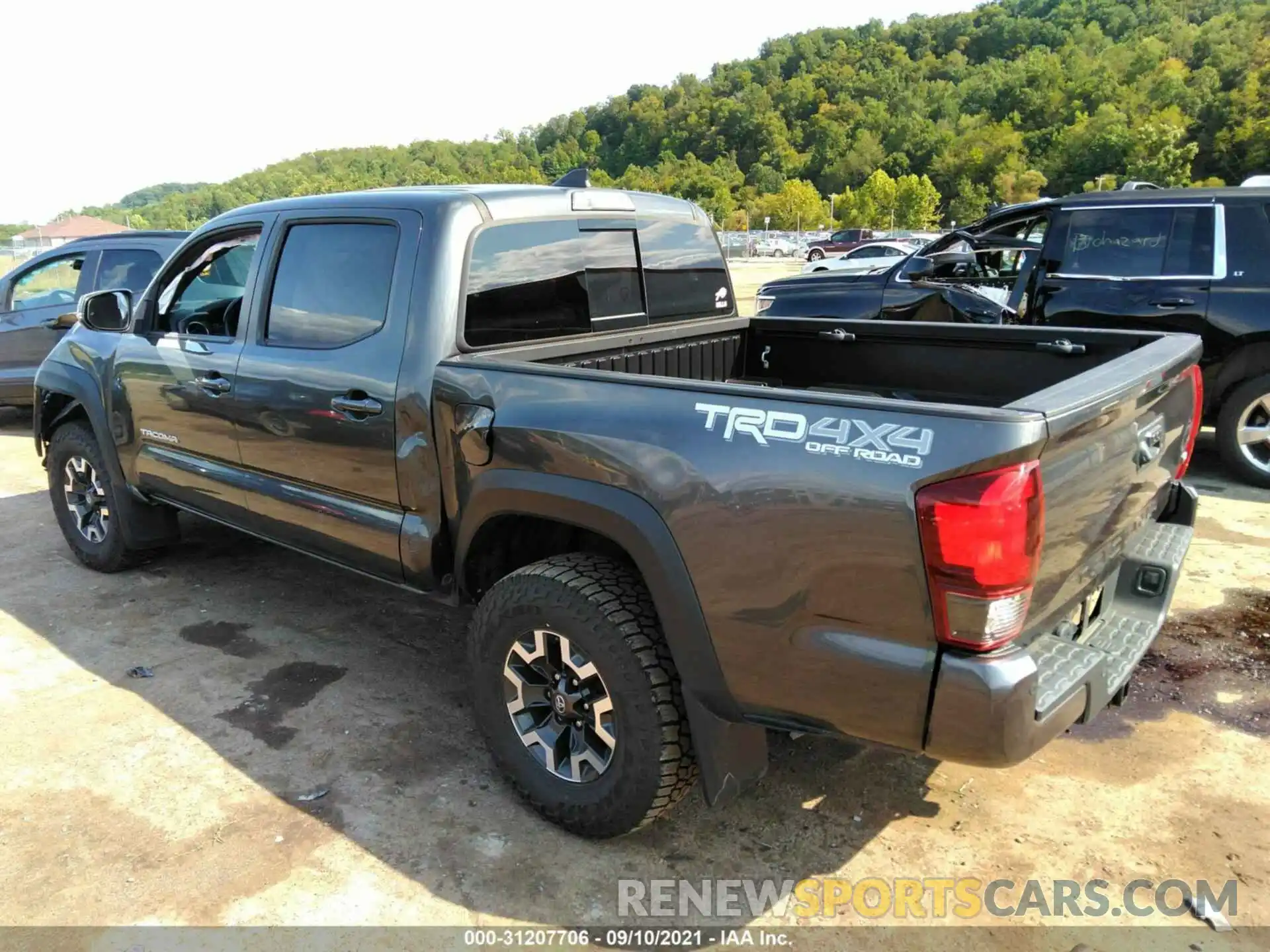 3 Photograph of a damaged car 3TMCZ5AN9KM220599 TOYOTA TACOMA 4WD 2019