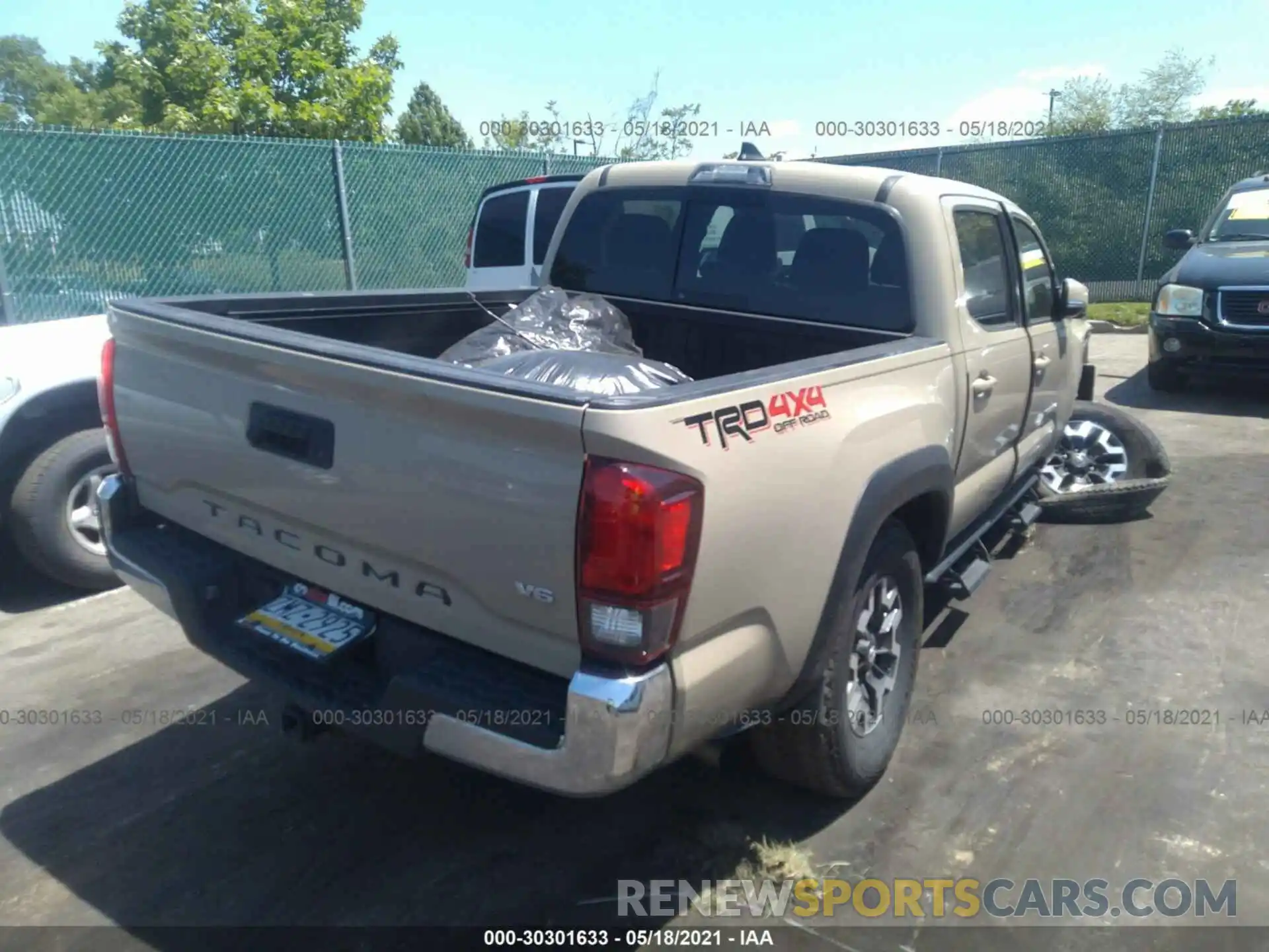 4 Photograph of a damaged car 3TMCZ5AN9KM282441 TOYOTA TACOMA 4WD 2019