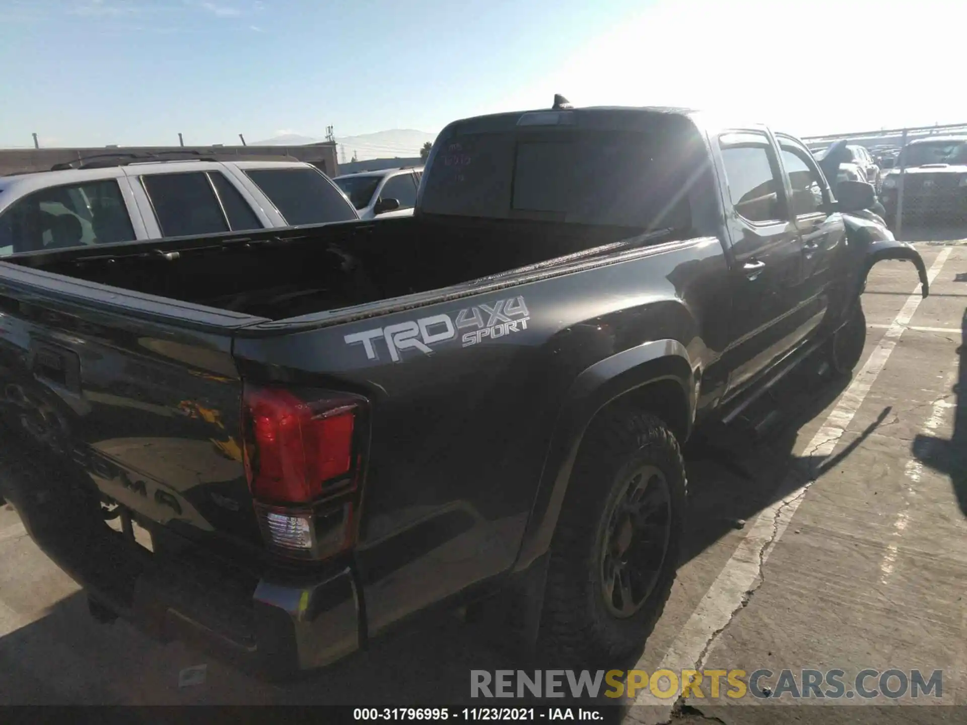 4 Photograph of a damaged car 3TMDZ5BN1KM063900 TOYOTA TACOMA 4WD 2019