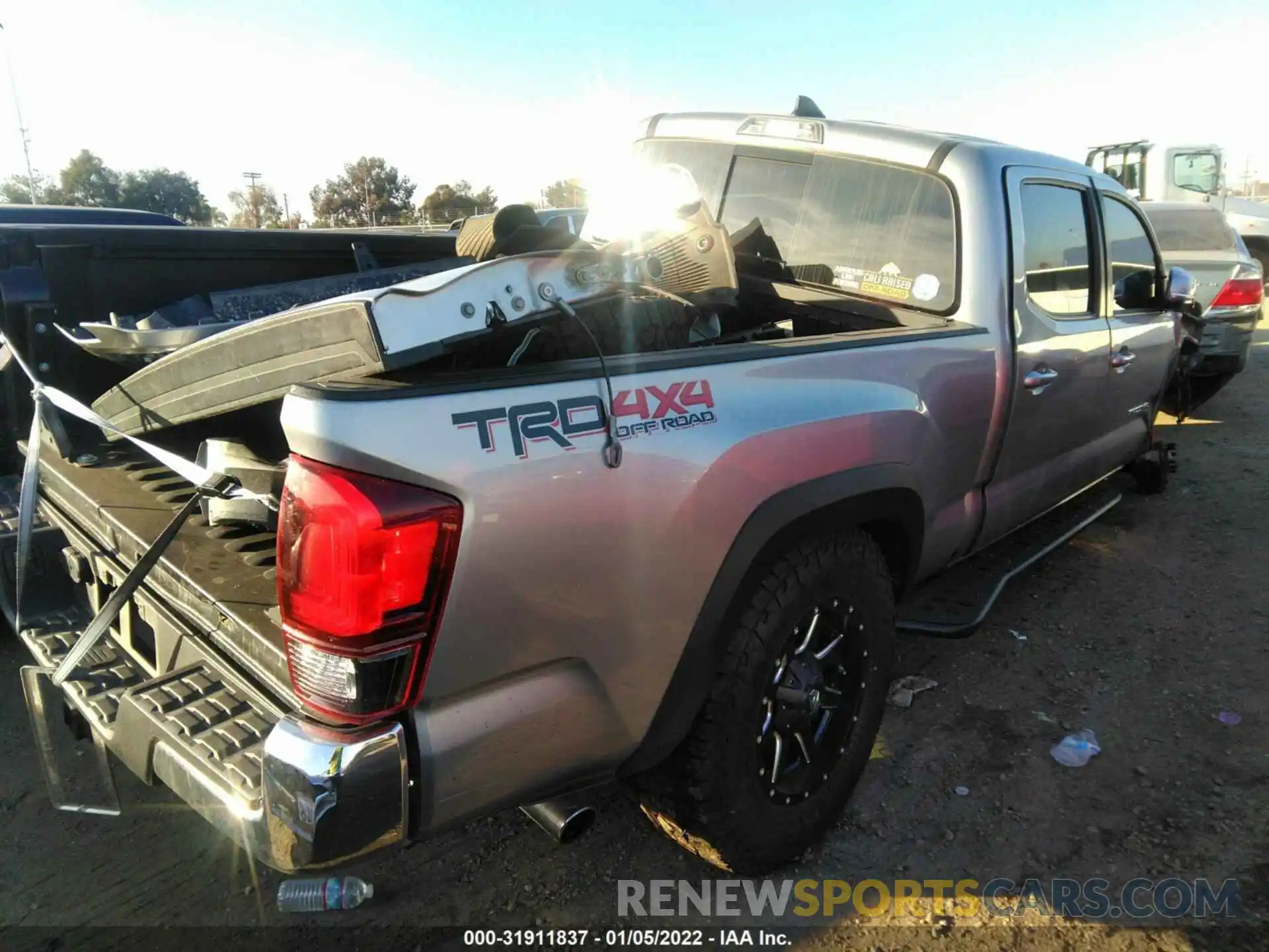 4 Photograph of a damaged car 3TMDZ5BN5KM057095 TOYOTA TACOMA 4WD 2019