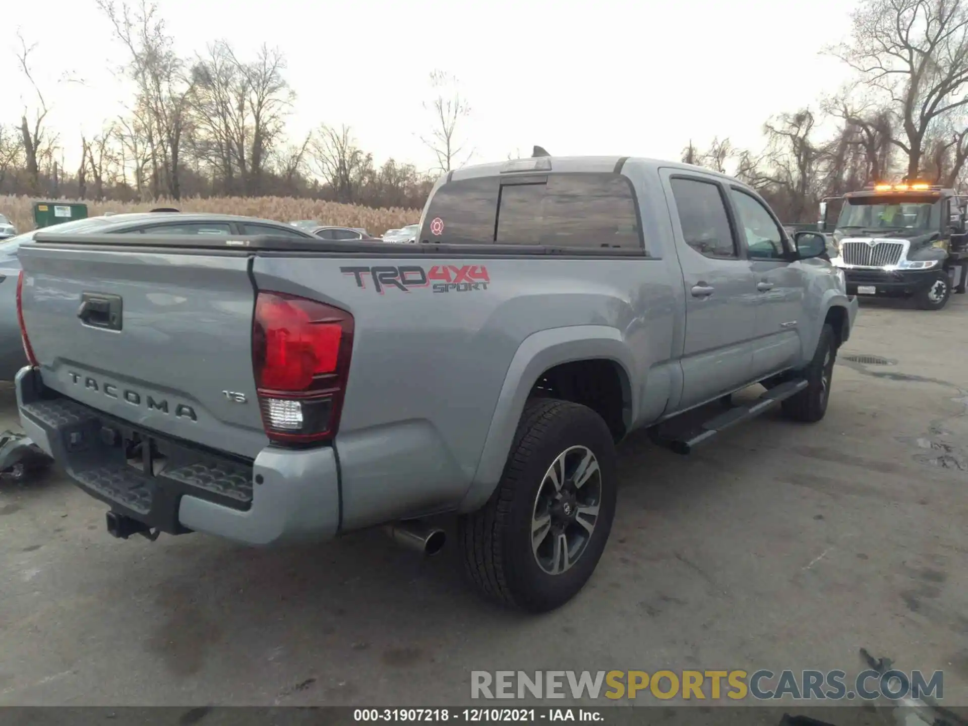 4 Photograph of a damaged car 3TMDZ5BN5KM064564 TOYOTA TACOMA 4WD 2019