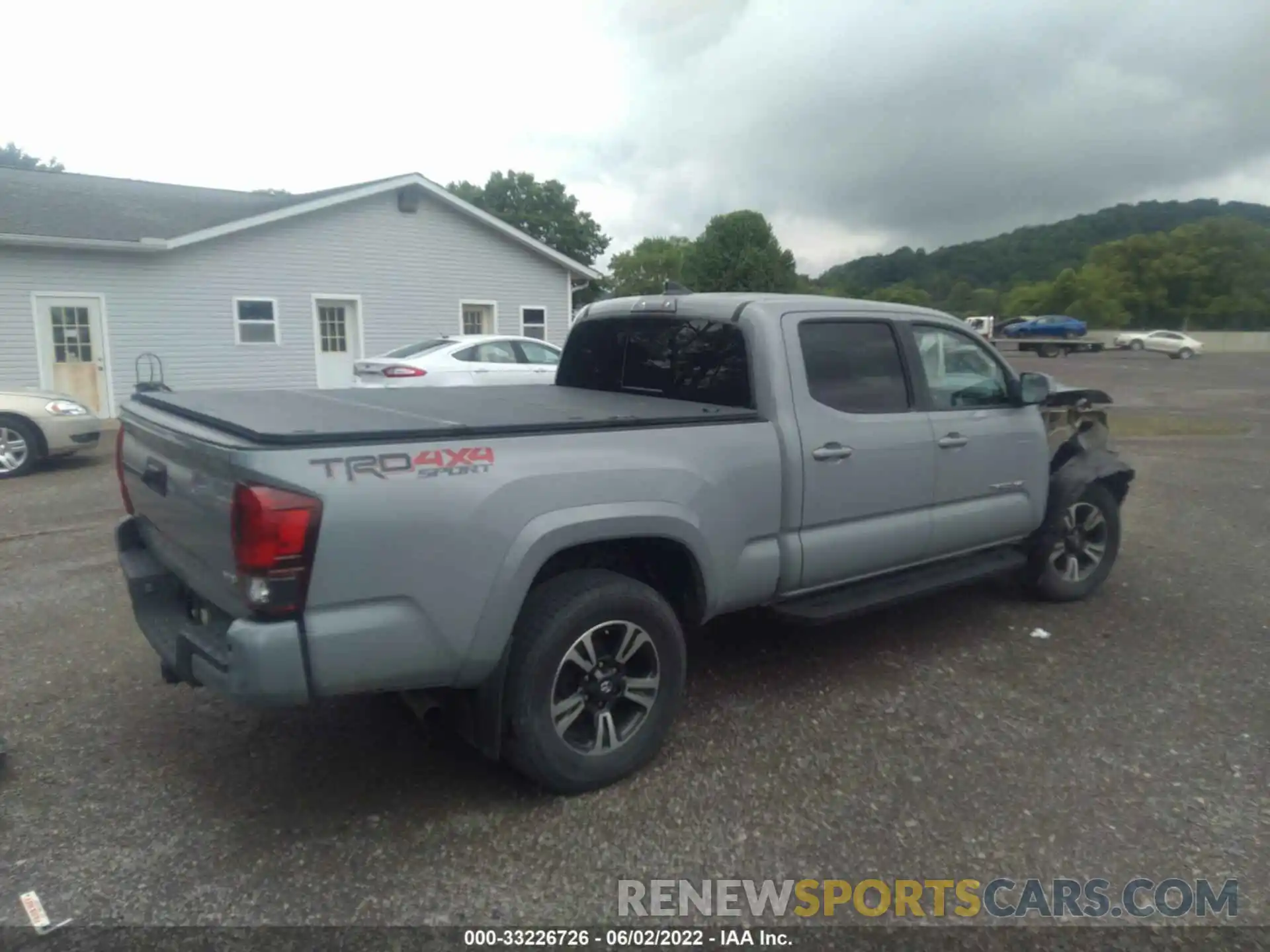 4 Photograph of a damaged car 3TMDZ5BN8KM056412 TOYOTA TACOMA 4WD 2019