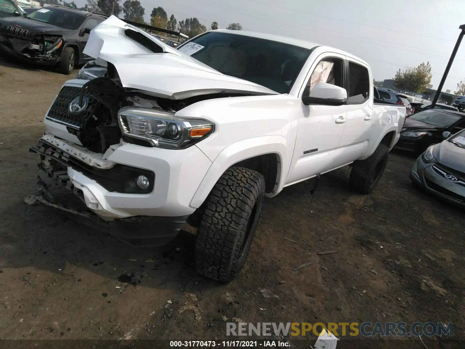 2 Photograph of a damaged car 3TMDZ5BN8KM069855 TOYOTA TACOMA 4WD 2019