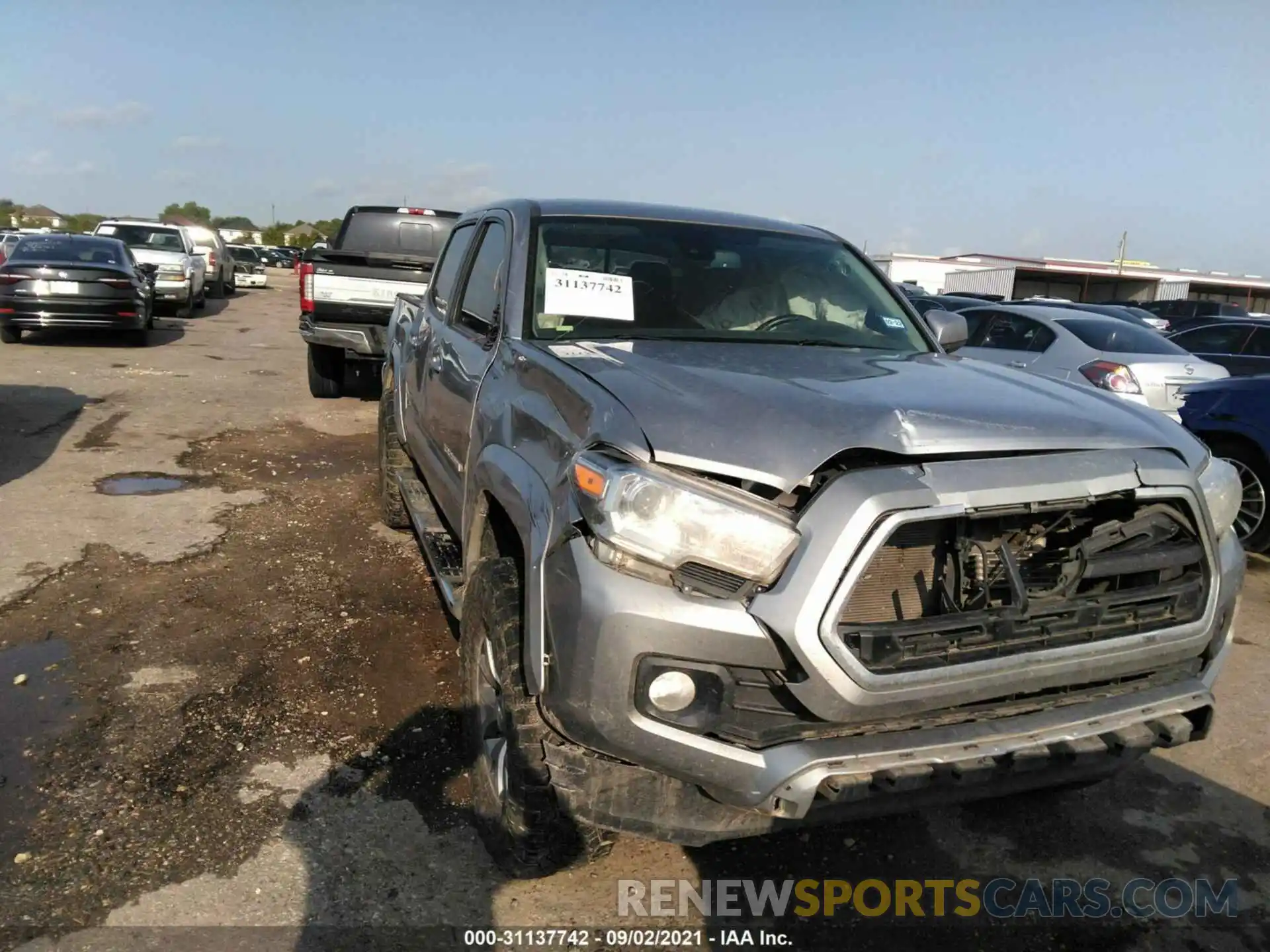 1 Photograph of a damaged car 5TFCZ5AN3KX209091 TOYOTA TACOMA 4WD 2019