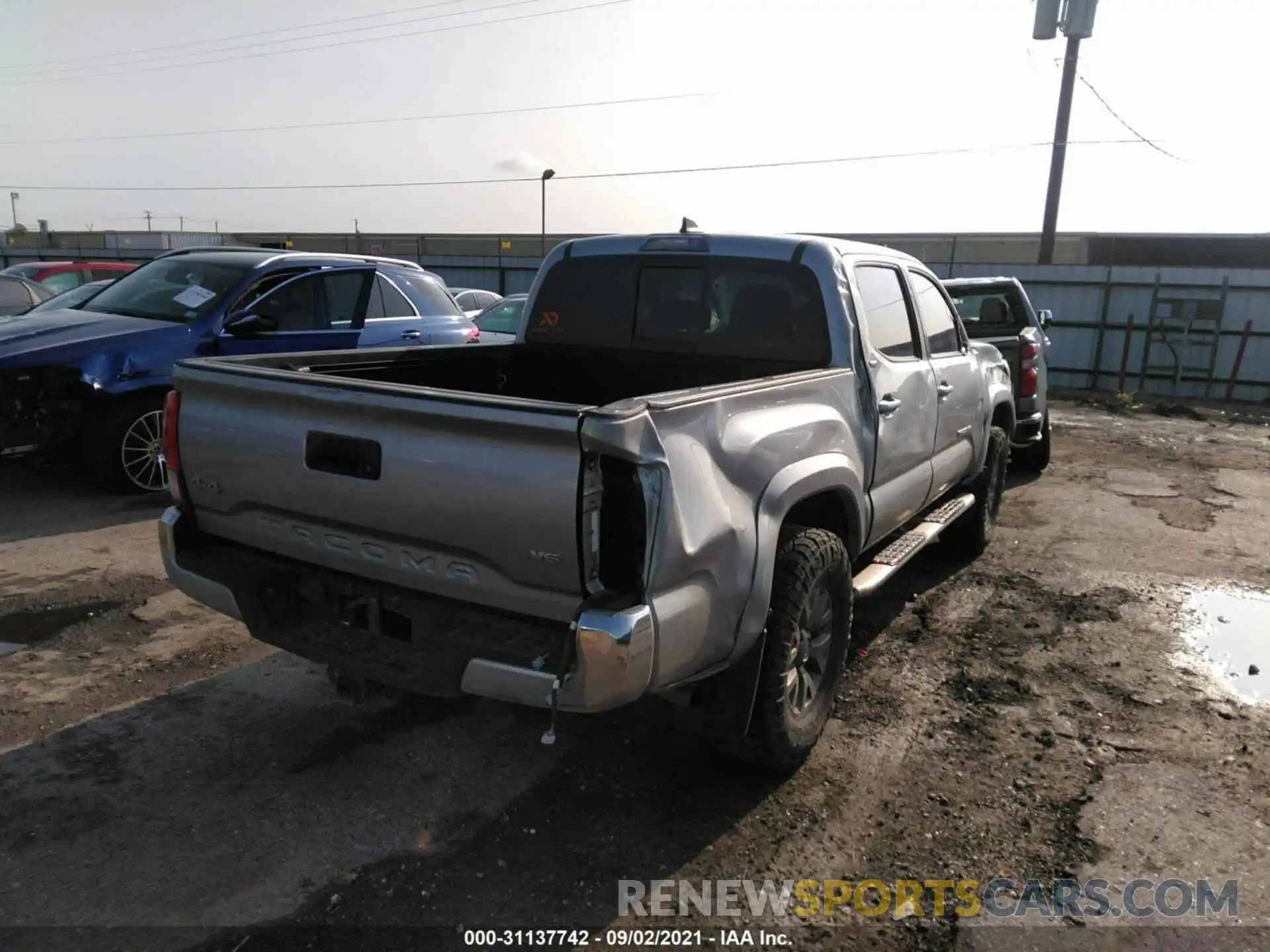 4 Photograph of a damaged car 5TFCZ5AN3KX209091 TOYOTA TACOMA 4WD 2019