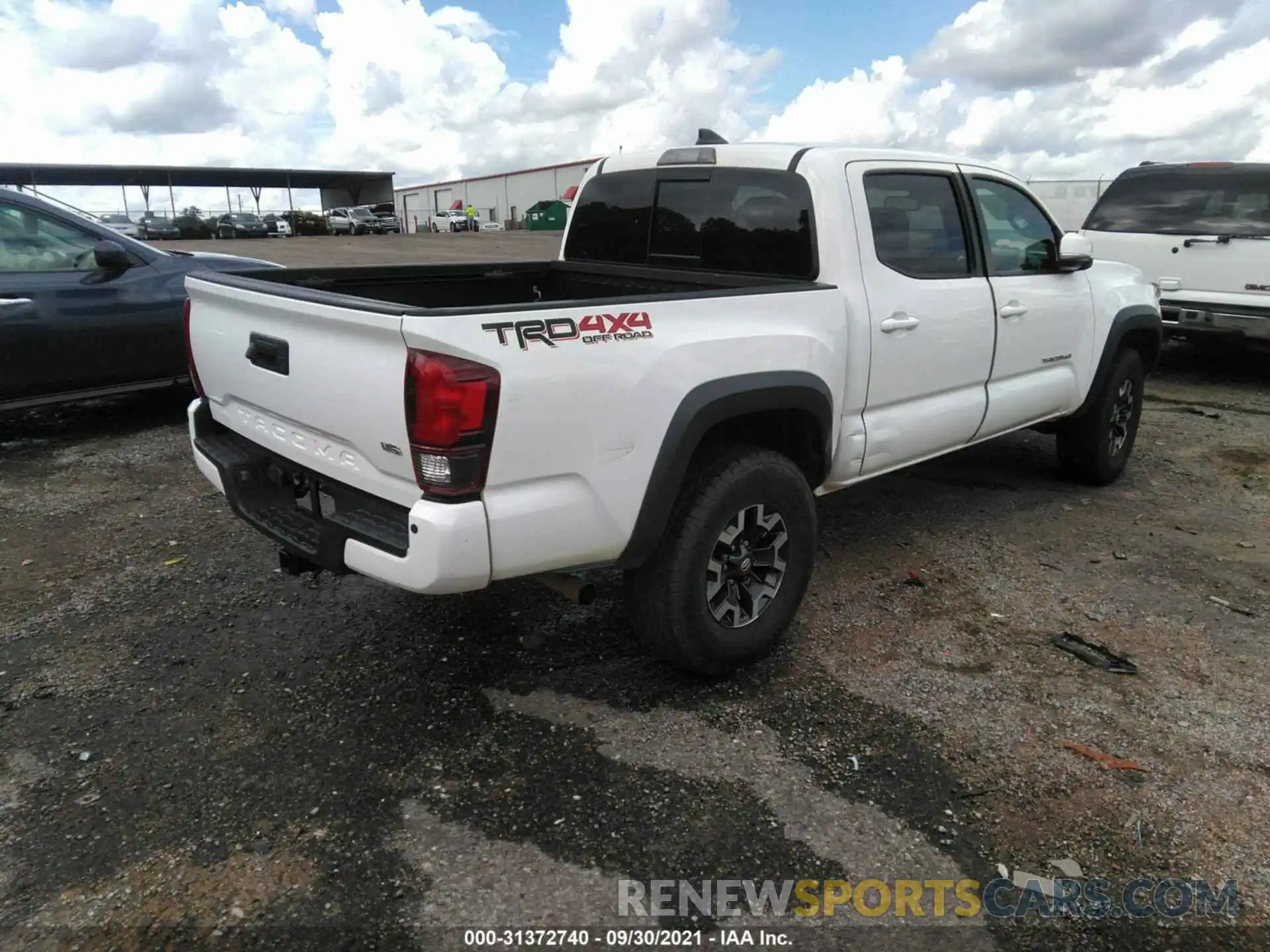 4 Photograph of a damaged car 5TFCZ5AN3KX211388 TOYOTA TACOMA 4WD 2019