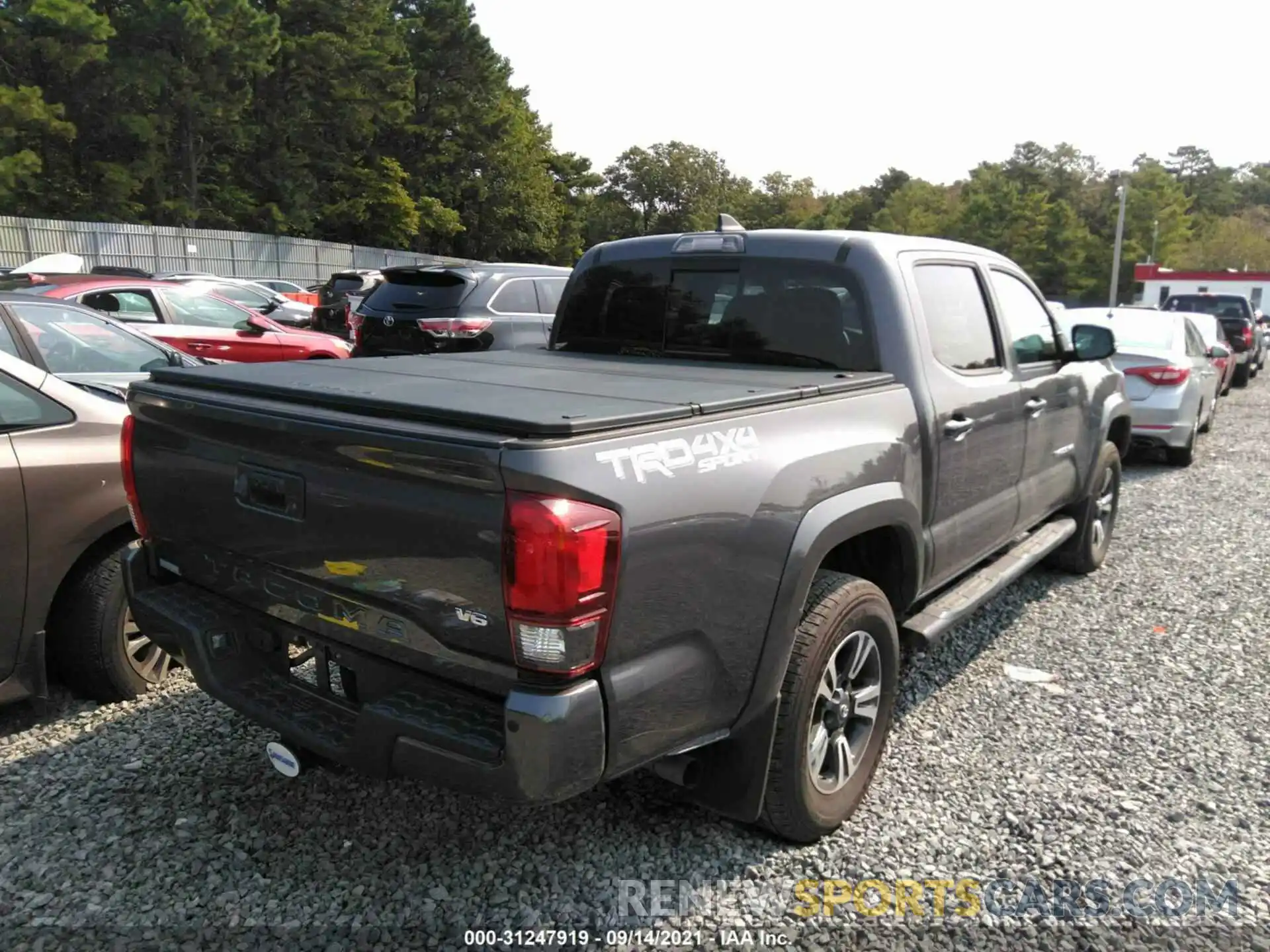 4 Photograph of a damaged car 5TFCZ5AN5KX202496 TOYOTA TACOMA 4WD 2019