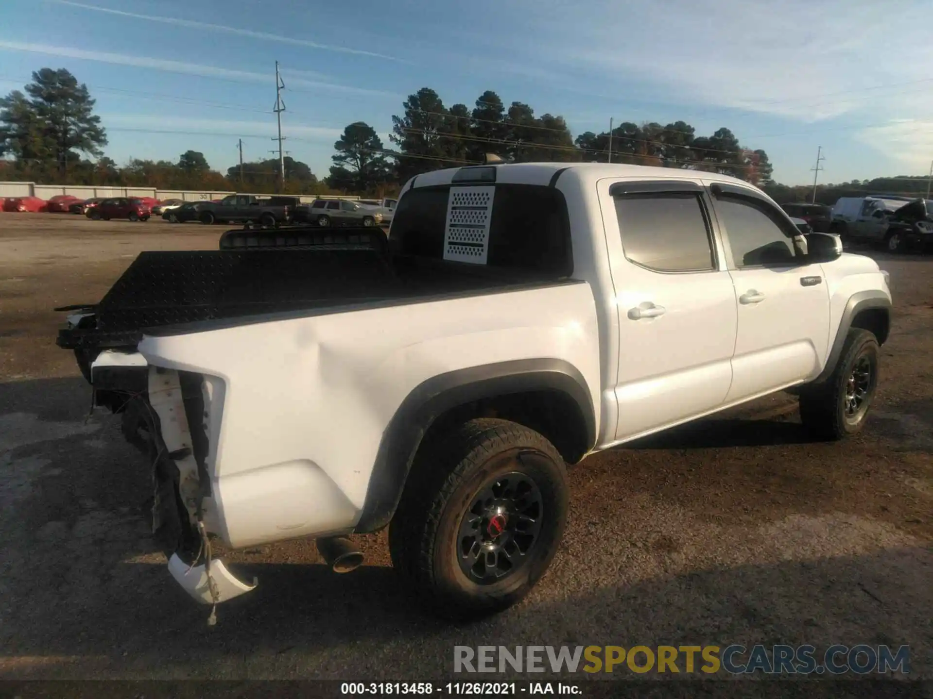 4 Photograph of a damaged car 5TFCZ5AN5KX206936 TOYOTA TACOMA 4WD 2019