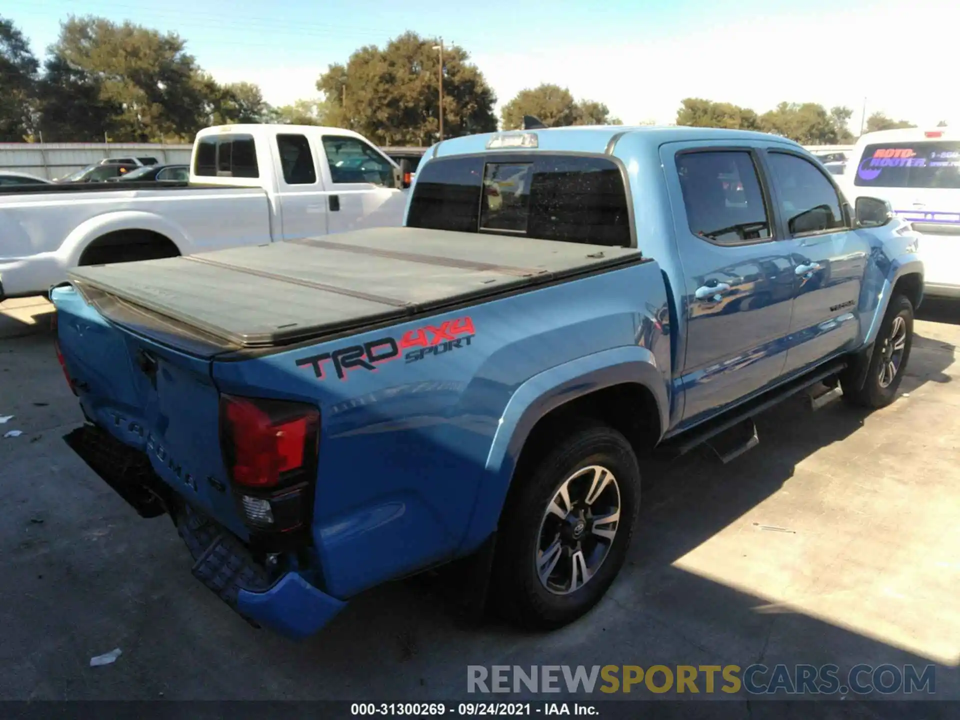 4 Photograph of a damaged car 5TFCZ5AN6KX212051 TOYOTA TACOMA 4WD 2019