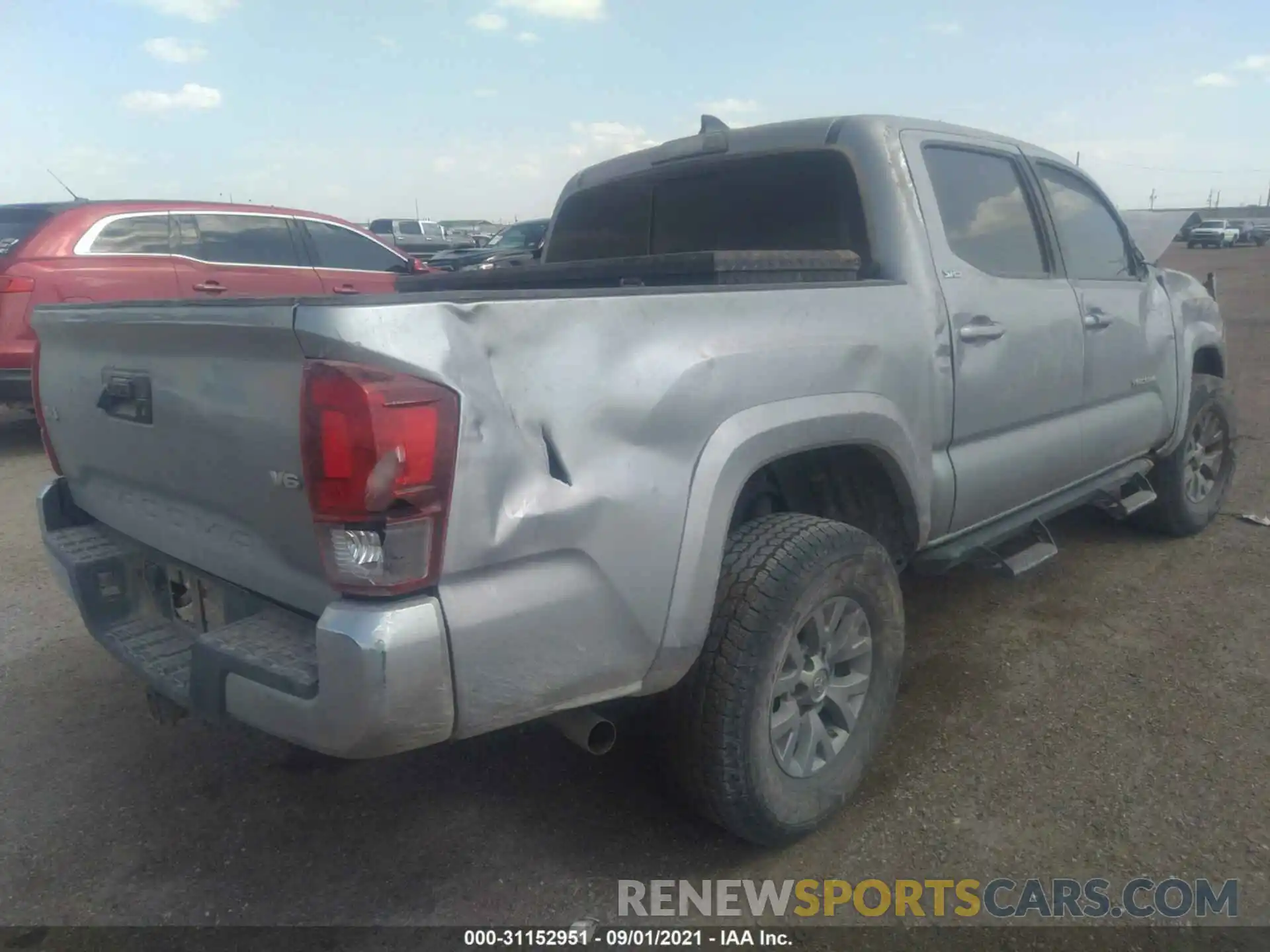 4 Photograph of a damaged car 5TFCZ5ANXKX210822 TOYOTA TACOMA 4WD 2019