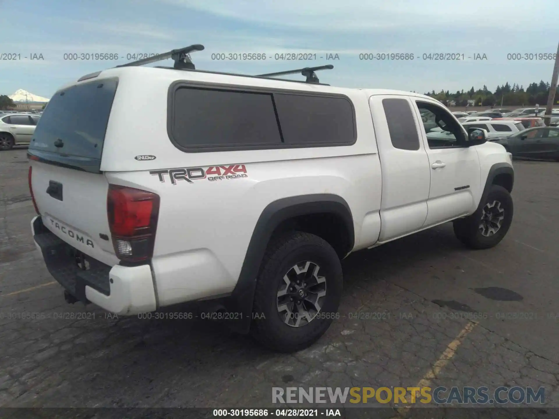 4 Photograph of a damaged car 5TFSZ5ANXKX196738 TOYOTA TACOMA 4WD 2019