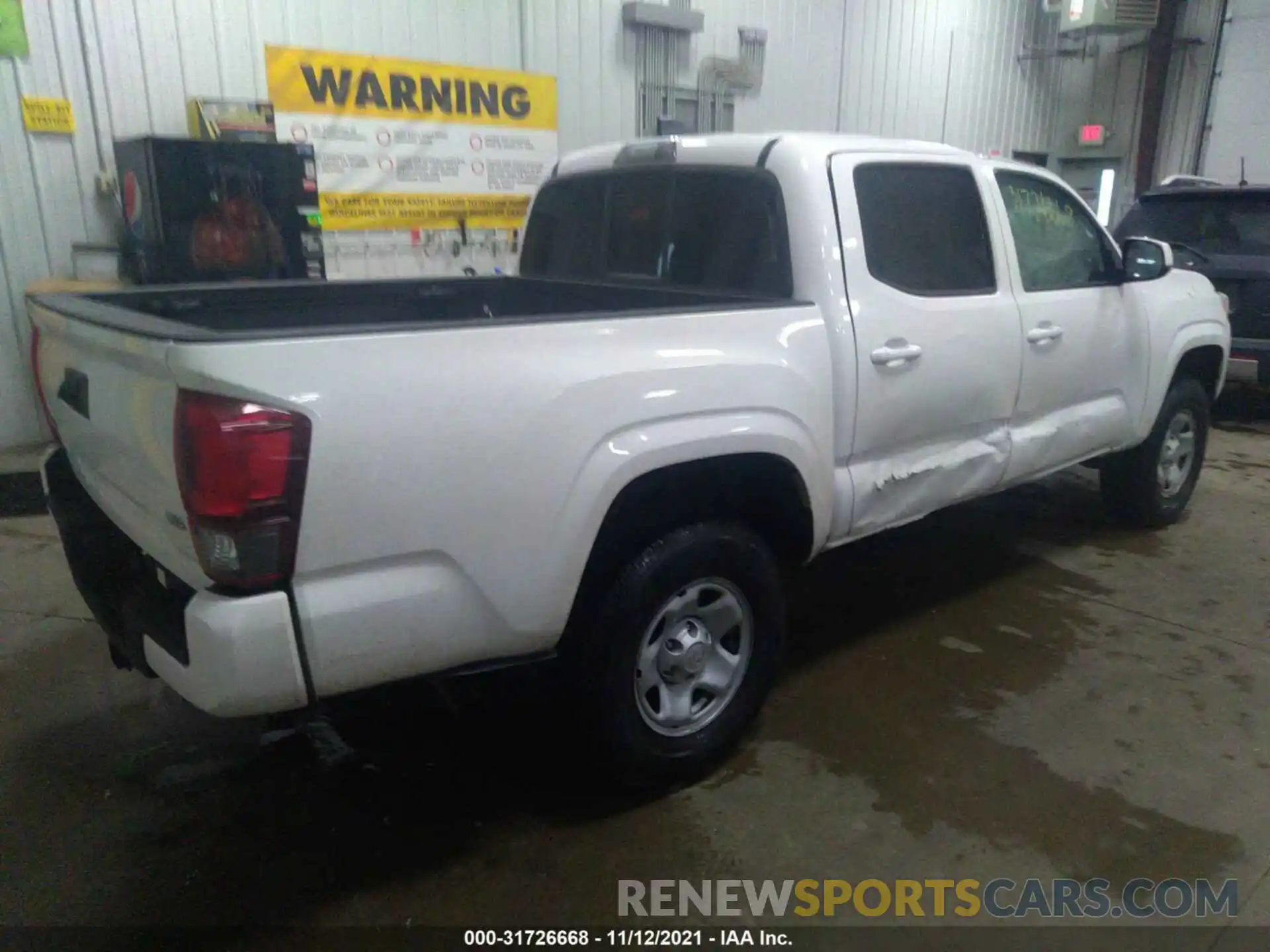 4 Photograph of a damaged car 3TMCZ5AN0LM336548 TOYOTA TACOMA 4WD 2020