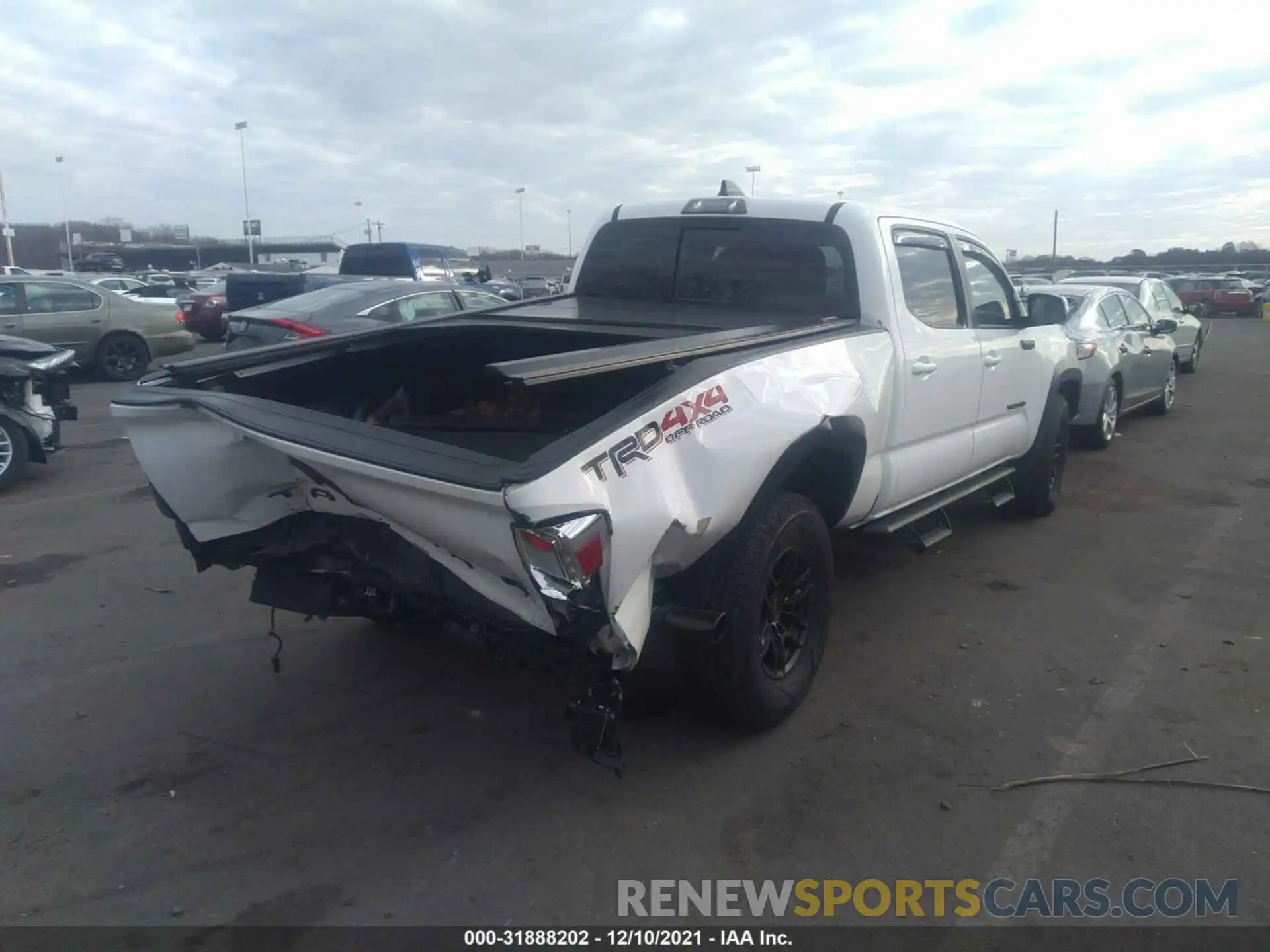 4 Photograph of a damaged car 3TMDZ5BN8LM090142 TOYOTA TACOMA 4WD 2020