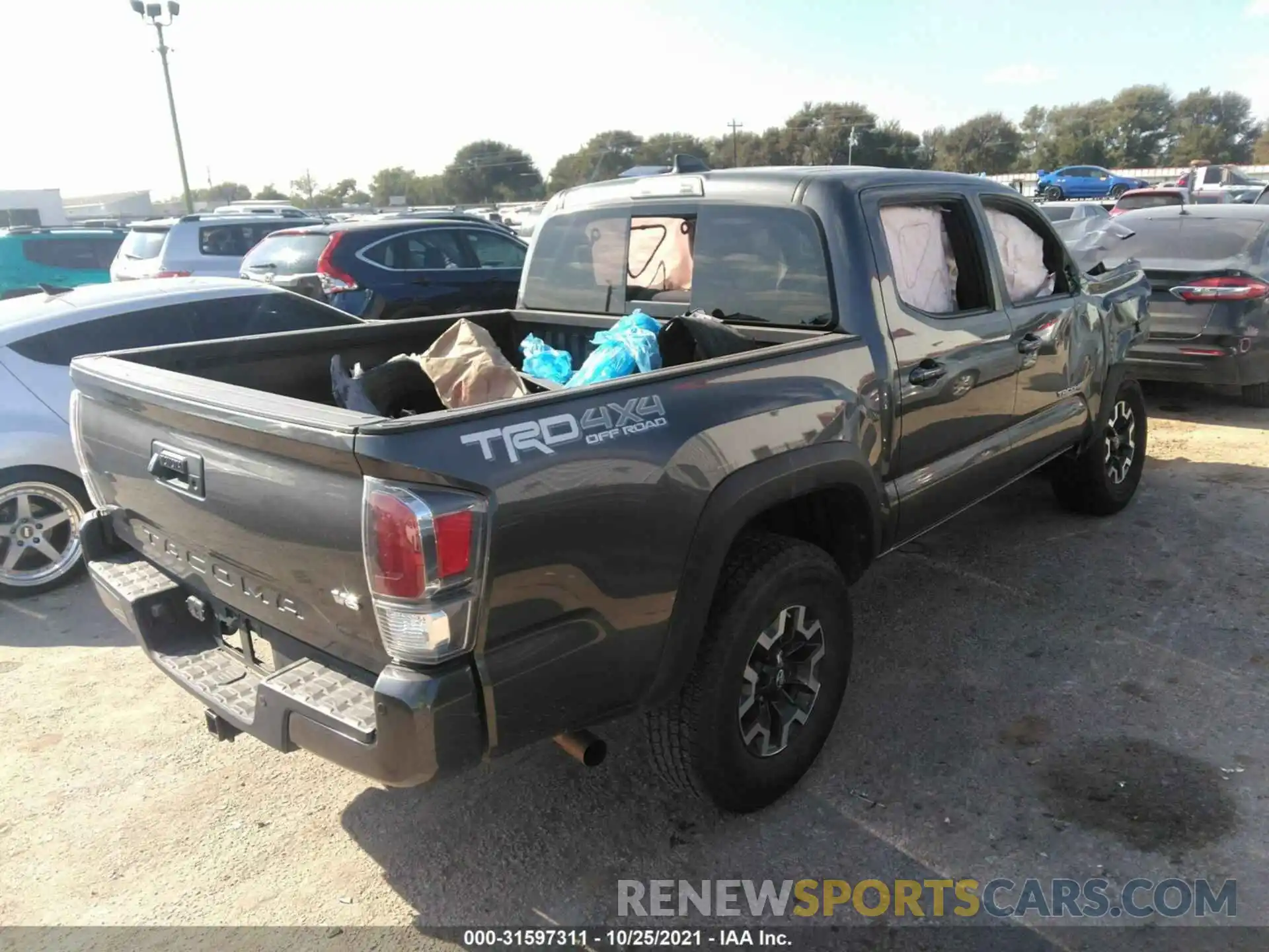 4 Photograph of a damaged car 5TFCZ5AN5LX230879 TOYOTA TACOMA 4WD 2020