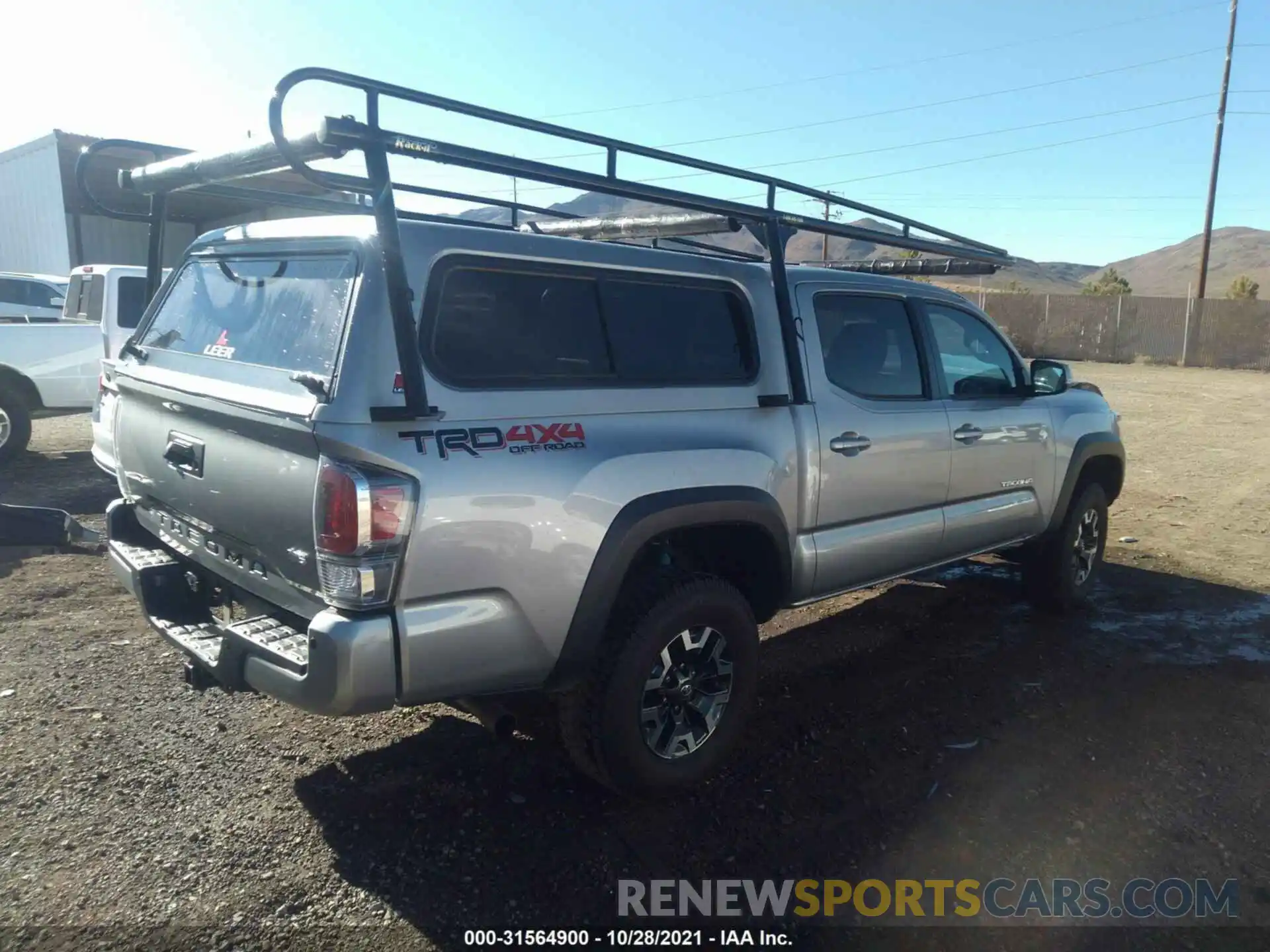 4 Photograph of a damaged car 5TFCZ5AN5LX234429 TOYOTA TACOMA 4WD 2020