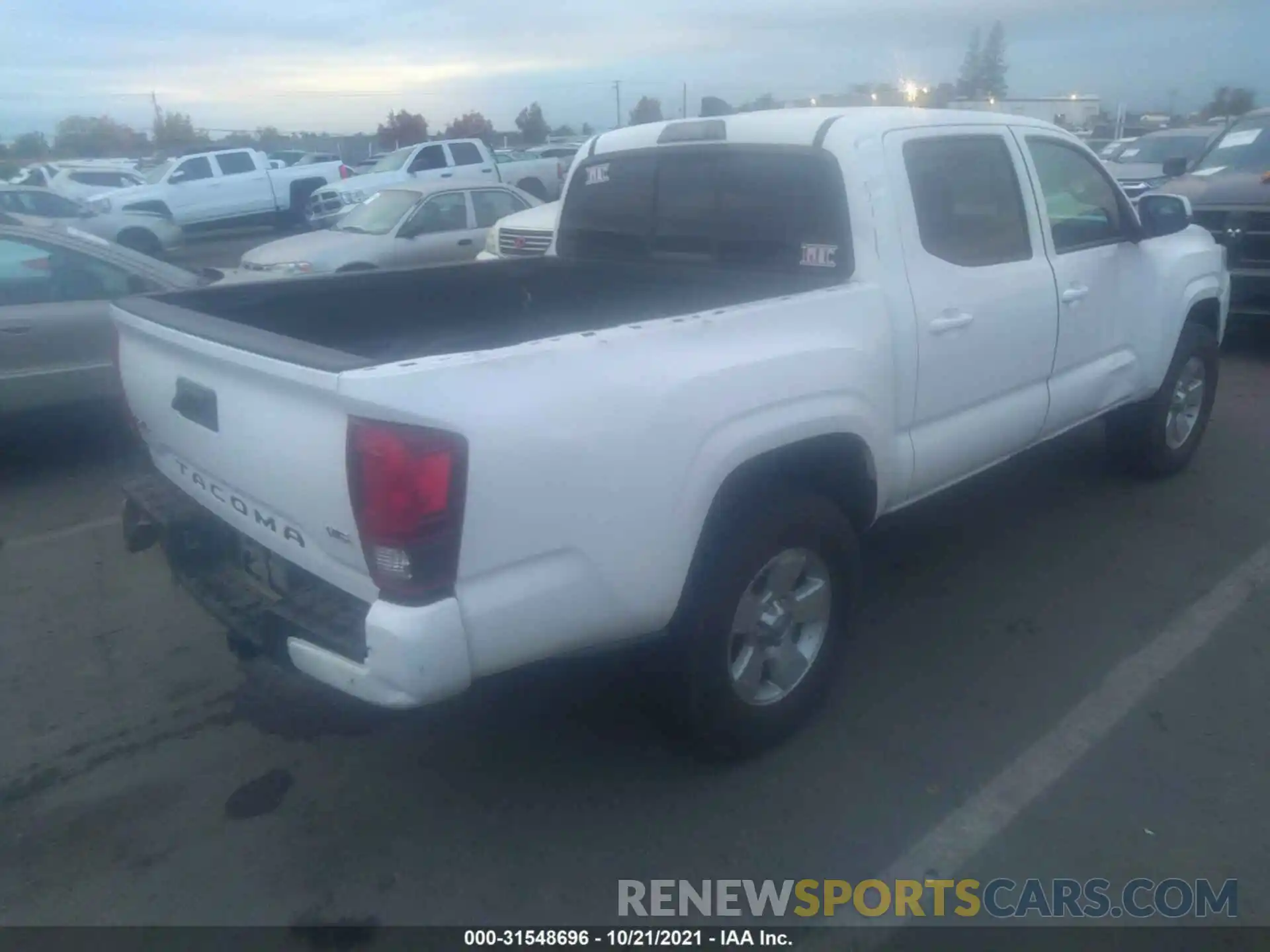 4 Photograph of a damaged car 3TMCZ5AN6MM376991 TOYOTA TACOMA 4WD 2021