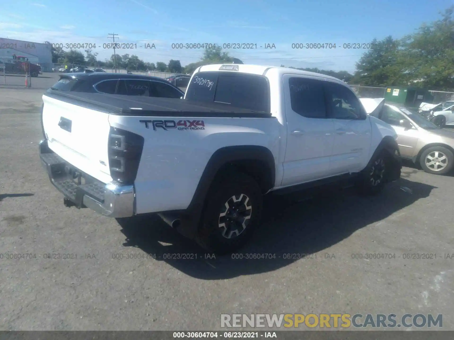 4 Photograph of a damaged car 3TMCZ5ANXMM395978 TOYOTA TACOMA 4WD 2021