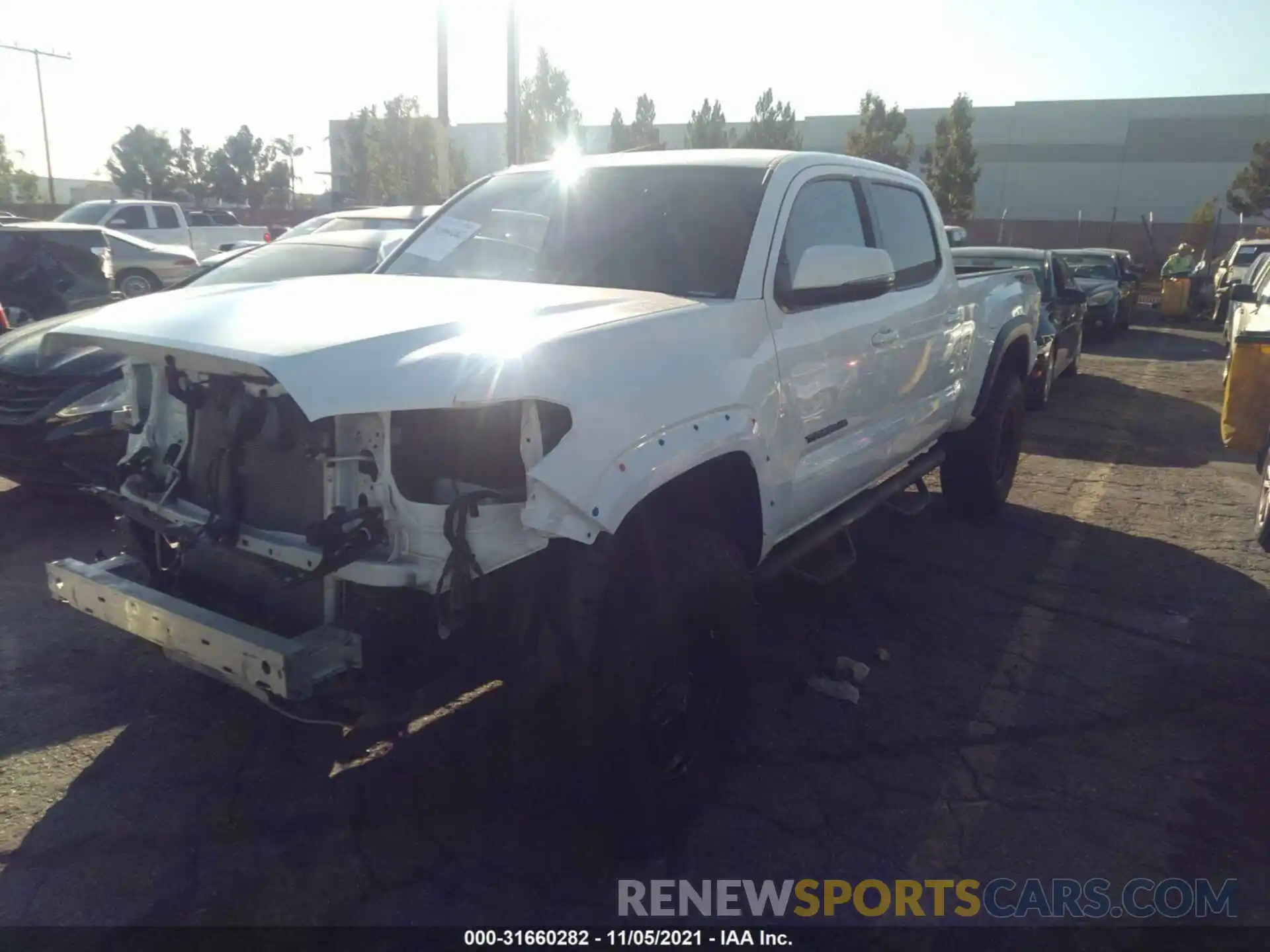 2 Photograph of a damaged car 3TMDZ5BN9MM101120 TOYOTA TACOMA 4WD 2021