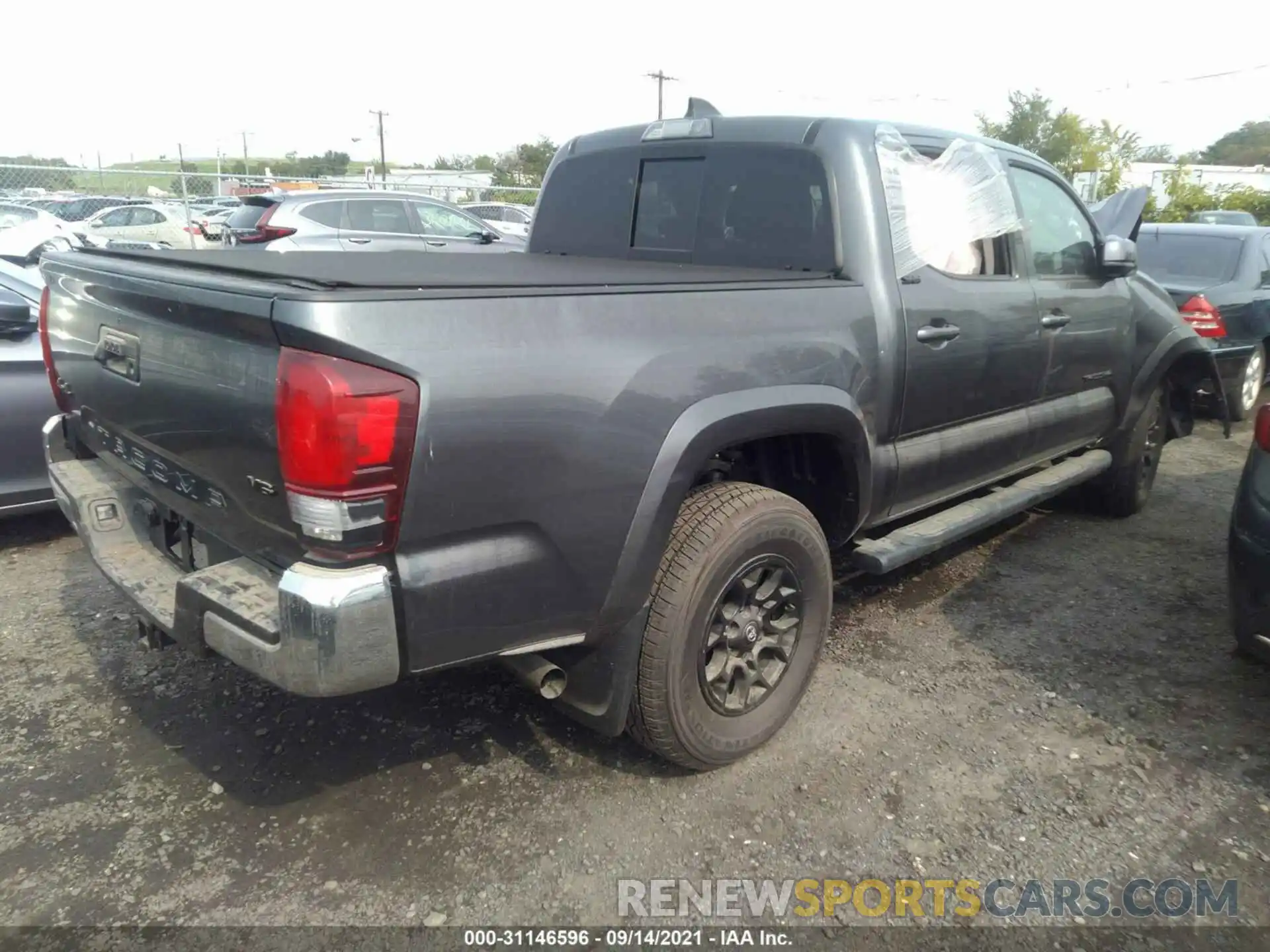 4 Photograph of a damaged car 3TYCZ5AN3MT033964 TOYOTA TACOMA 4WD 2021