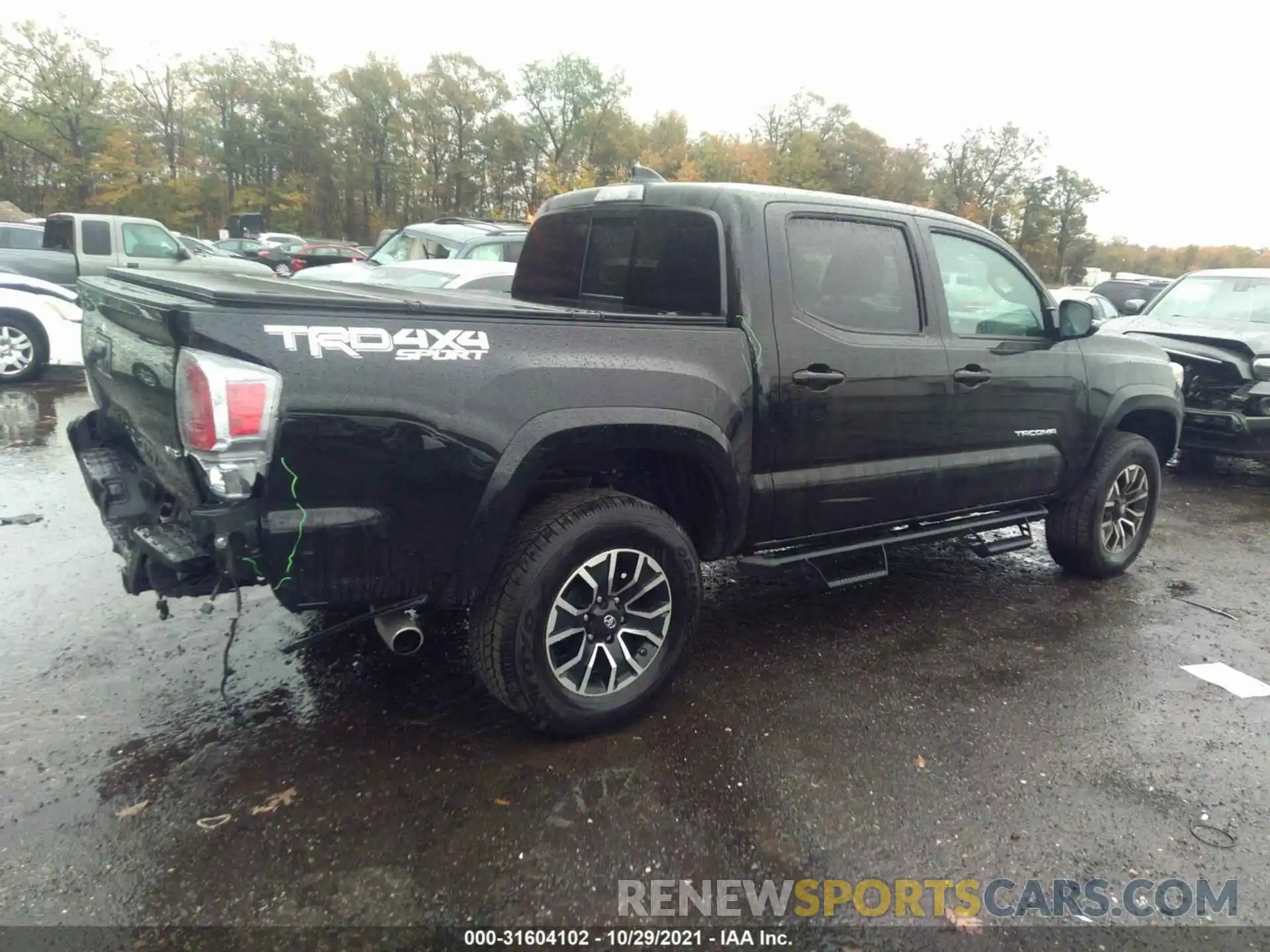 4 Photograph of a damaged car 3TYCZ5AN5MT021511 TOYOTA TACOMA 4WD 2021