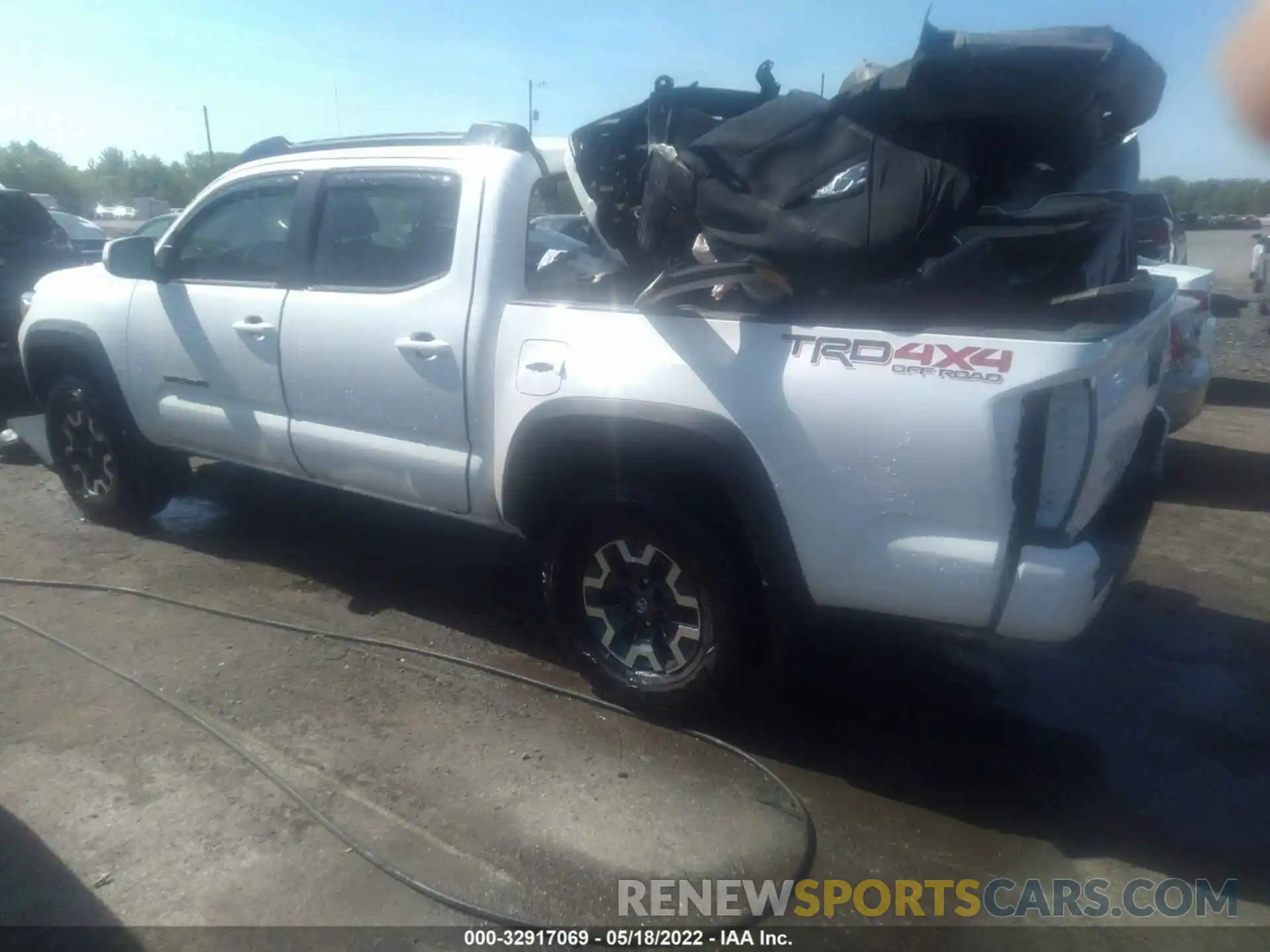 3 Photograph of a damaged car 3TYCZ5AN9MT035122 TOYOTA TACOMA 4WD 2021