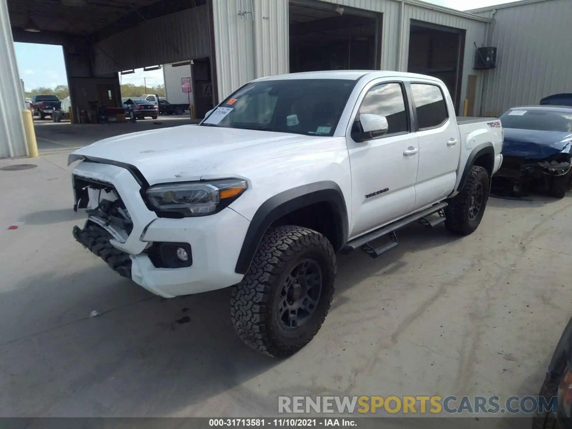 2 Photograph of a damaged car 5TFCZ5AN0MX255769 TOYOTA TACOMA 4WD 2021