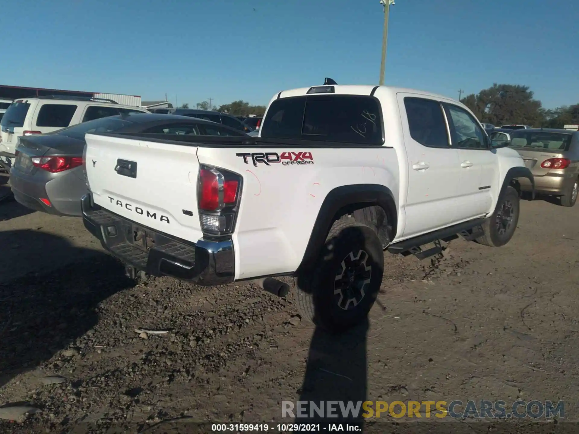 4 Photograph of a damaged car 5TFCZ5AN1MX250483 TOYOTA TACOMA 4WD 2021