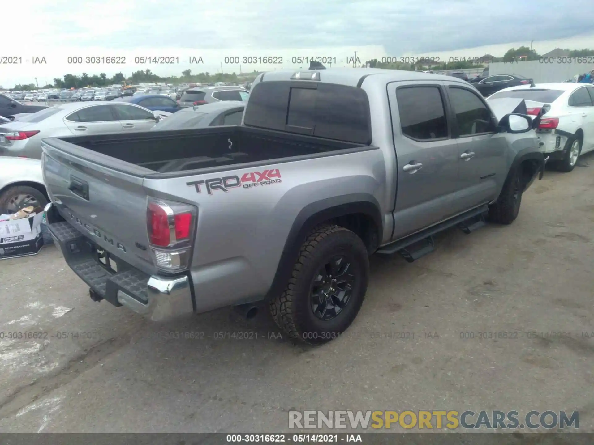 4 Photograph of a damaged car 5TFCZ5AN4MX251515 TOYOTA TACOMA 4WD 2021