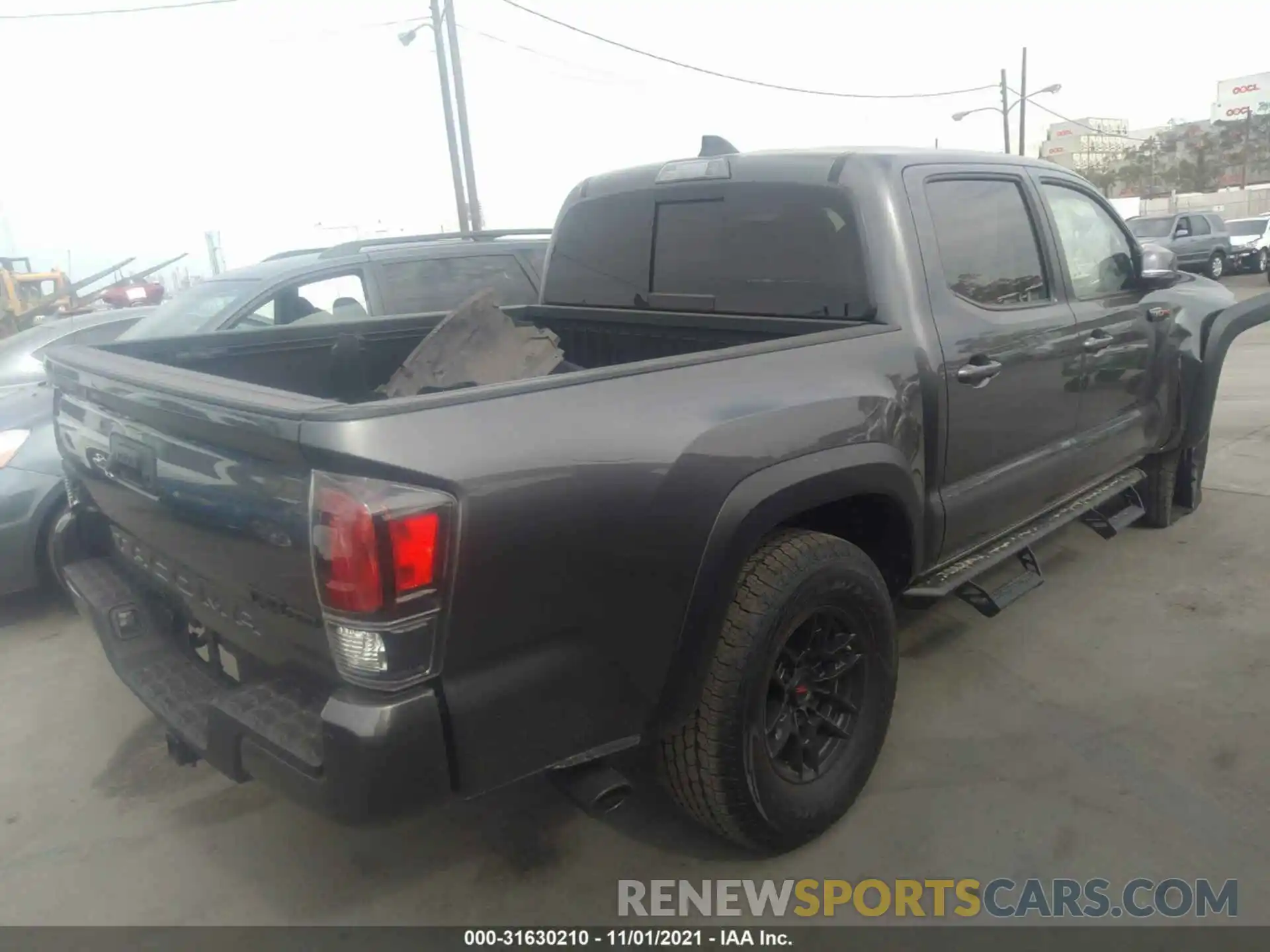 4 Photograph of a damaged car 5TFCZ5AN5MX245075 TOYOTA TACOMA 4WD 2021