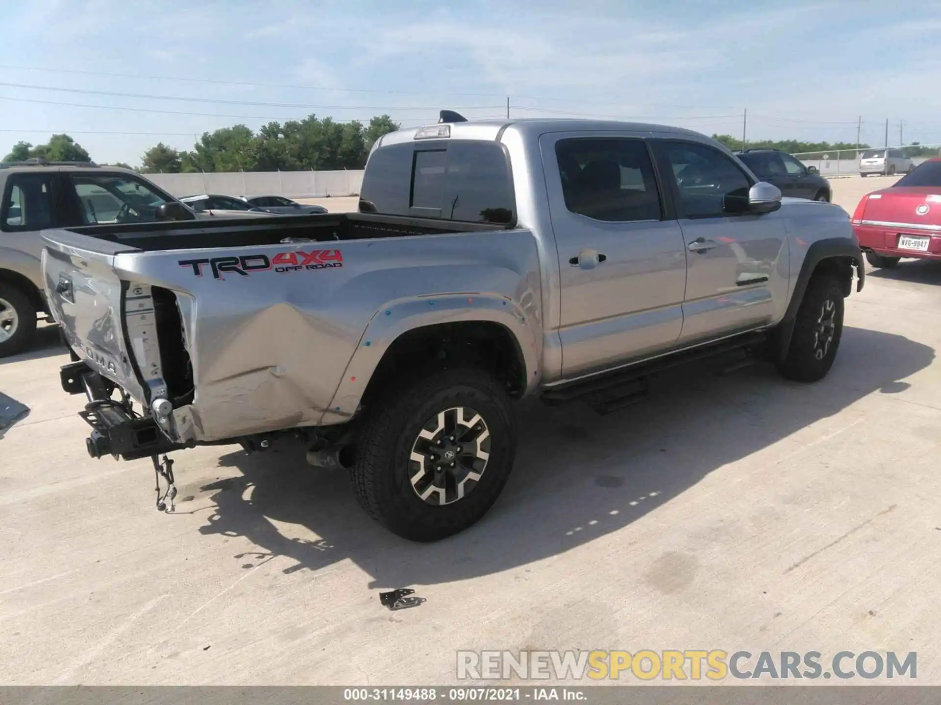 4 Photograph of a damaged car 5TFCZ5AN7MX273041 TOYOTA TACOMA 4WD 2021