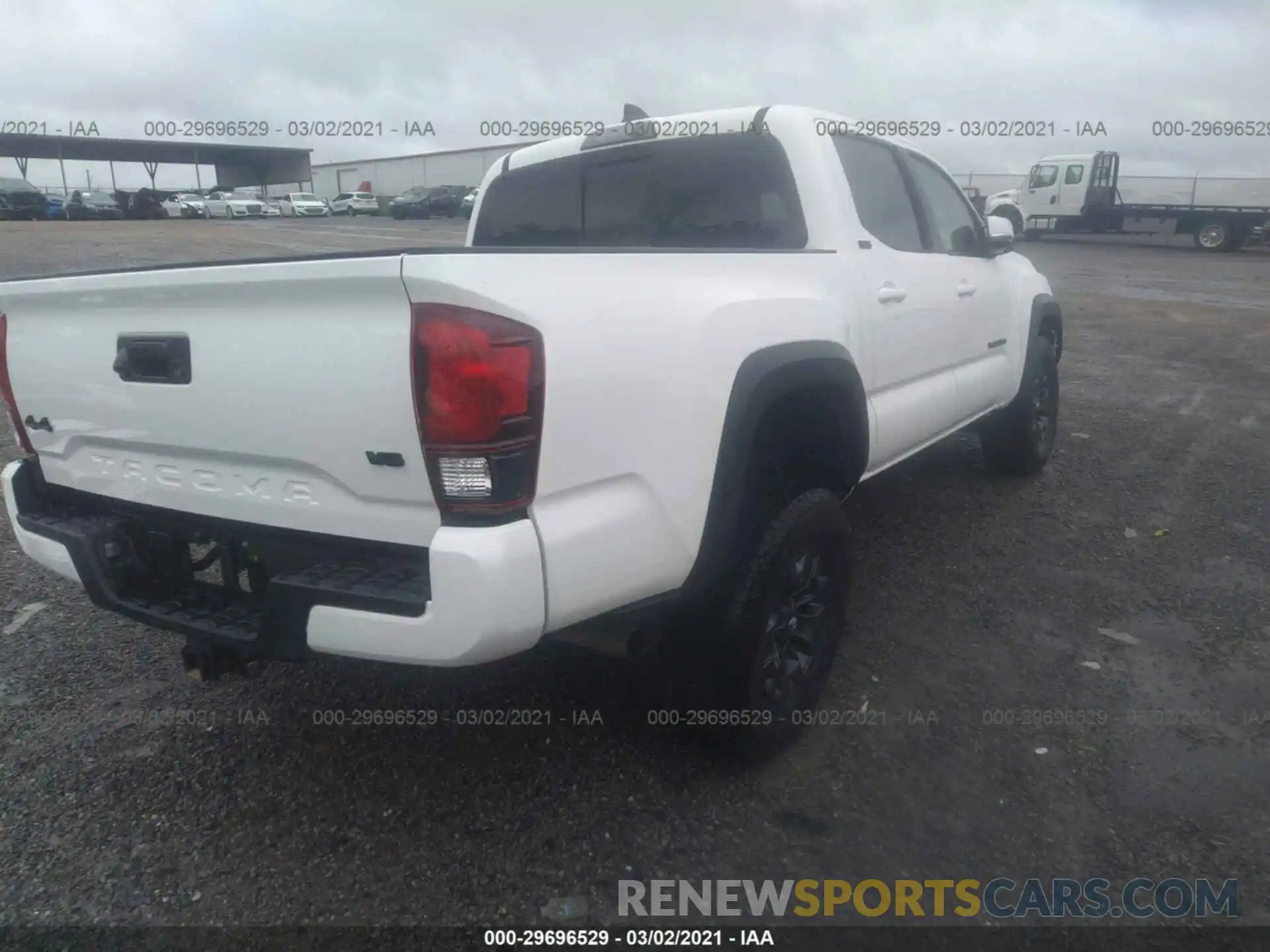 4 Photograph of a damaged car 5TFCZ5AN9MX246780 TOYOTA TACOMA 4WD 2021