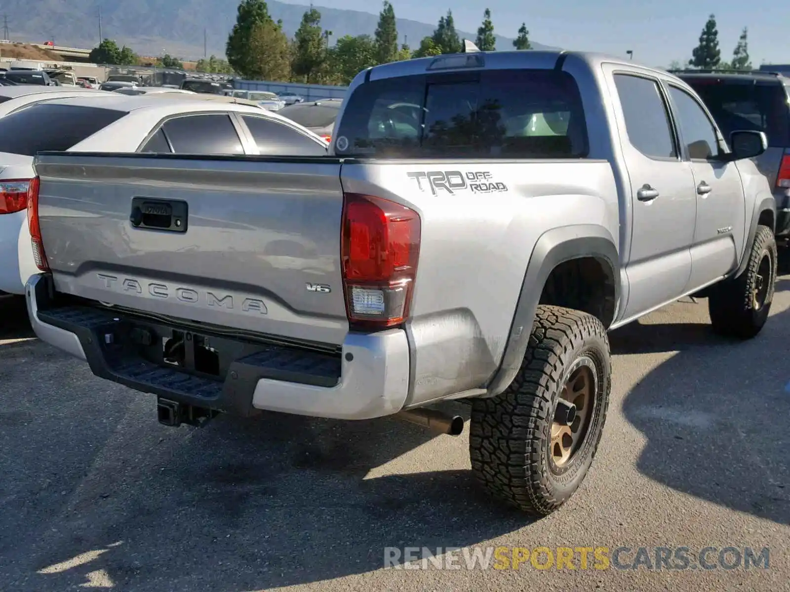 4 Photograph of a damaged car 3TMAZ5CN2KM089987 TOYOTA TACOMA DOU 2019