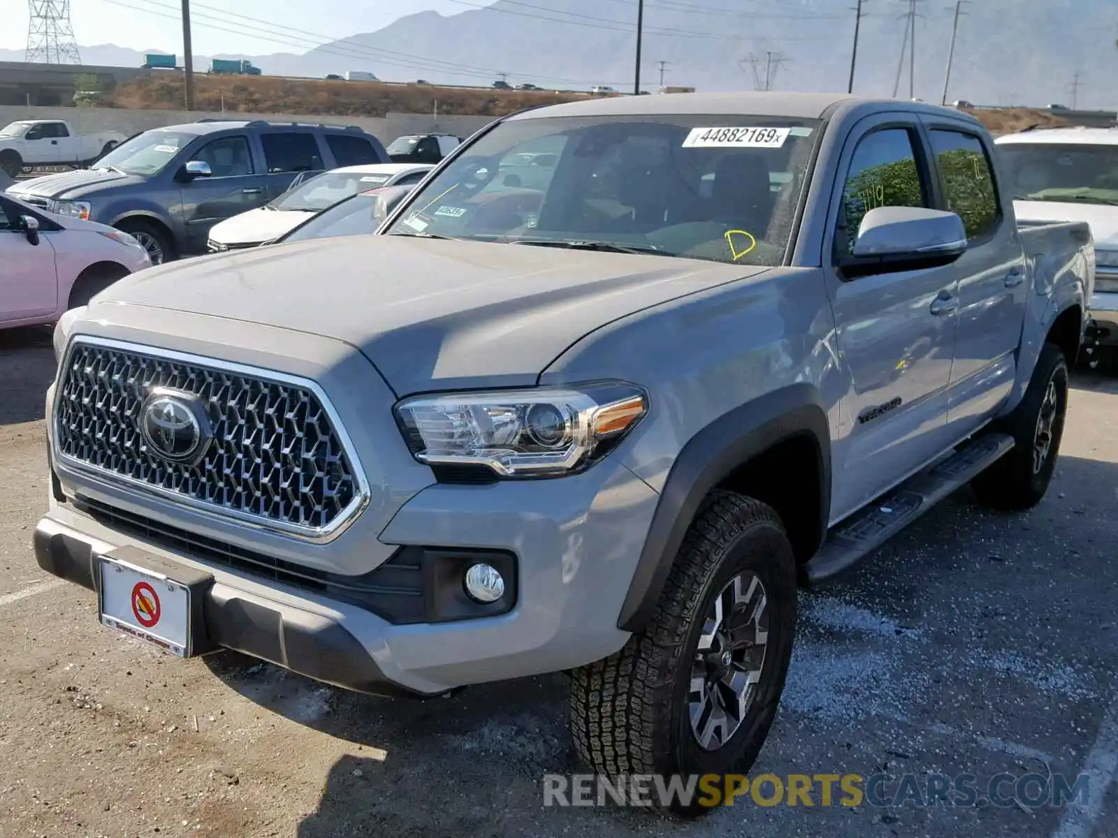 2 Photograph of a damaged car 3TMAZ5CN3KM104853 TOYOTA TACOMA DOU 2019