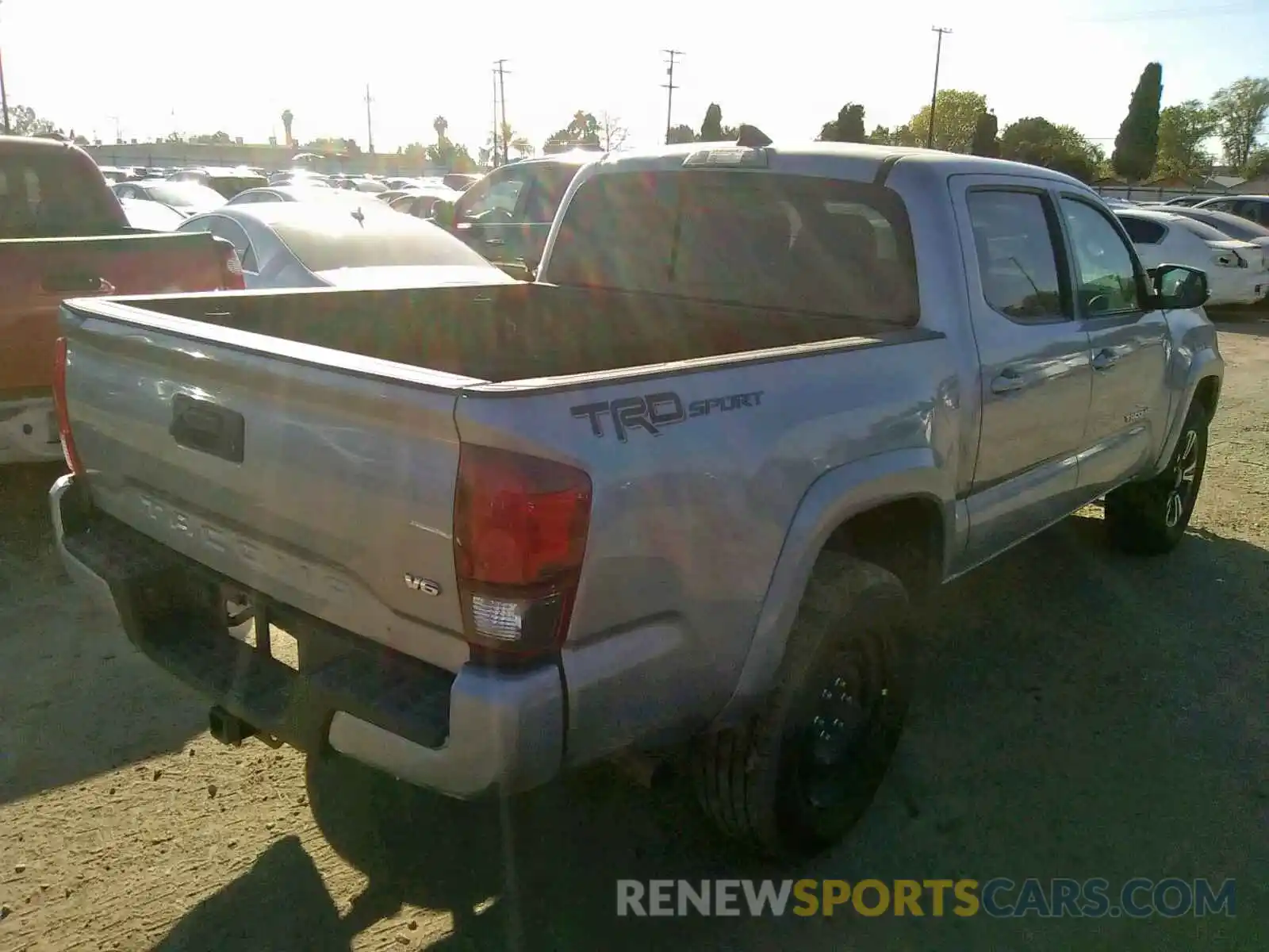 4 Photograph of a damaged car 3TMAZ5CN9KM090618 TOYOTA TACOMA DOU 2019