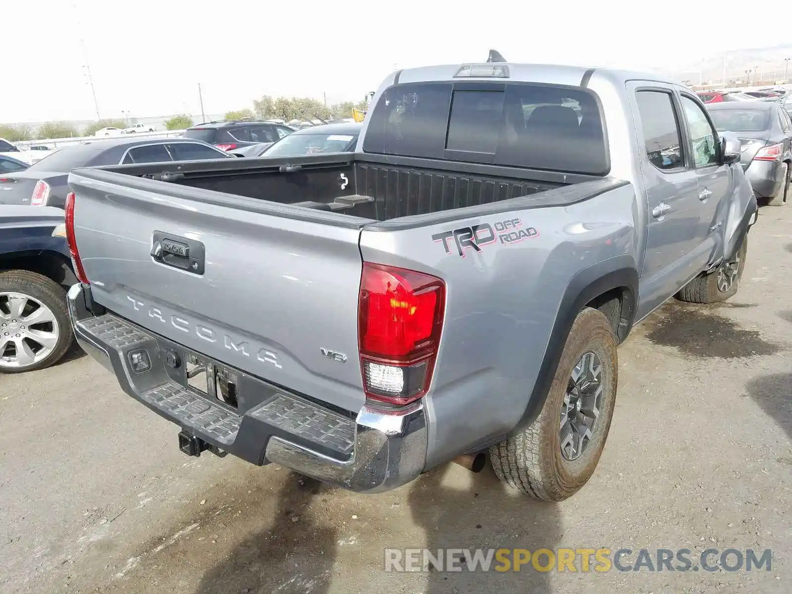 4 Photograph of a damaged car 3TMAZ5CNXKM096654 TOYOTA TACOMA DOU 2019