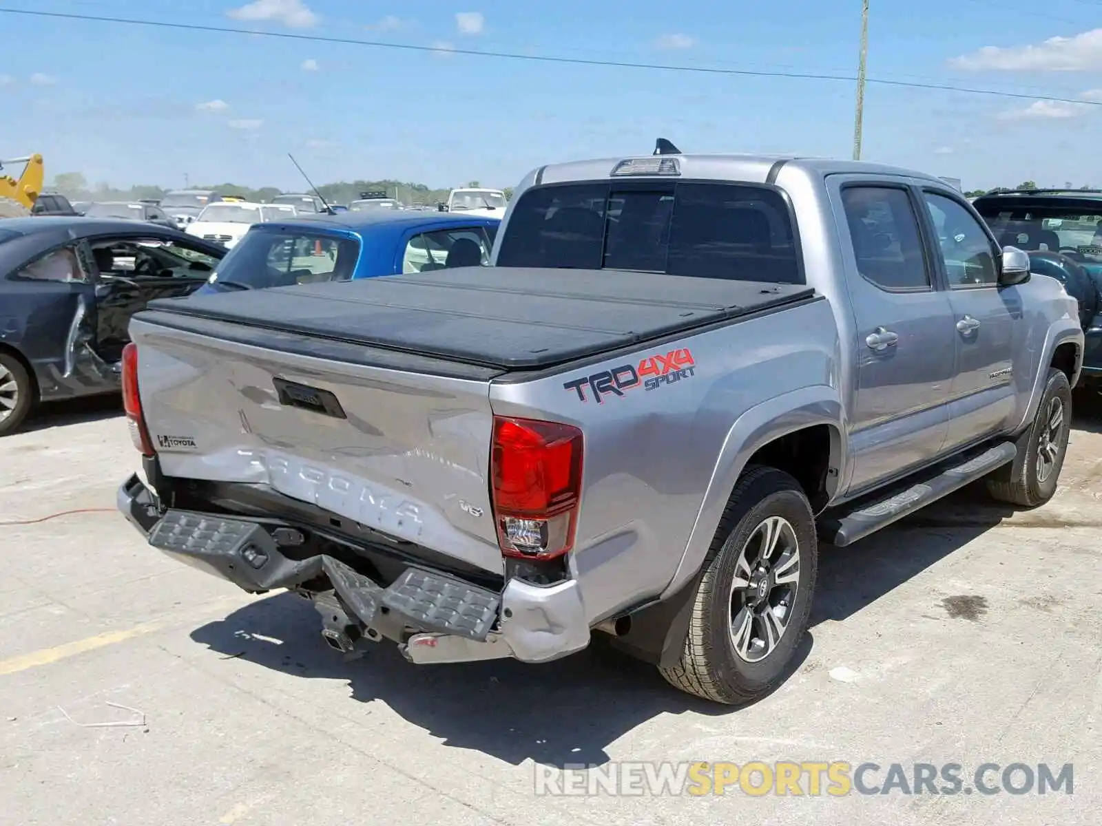 4 Photograph of a damaged car 3TMCZ5AN0KM225495 TOYOTA TACOMA DOU 2019