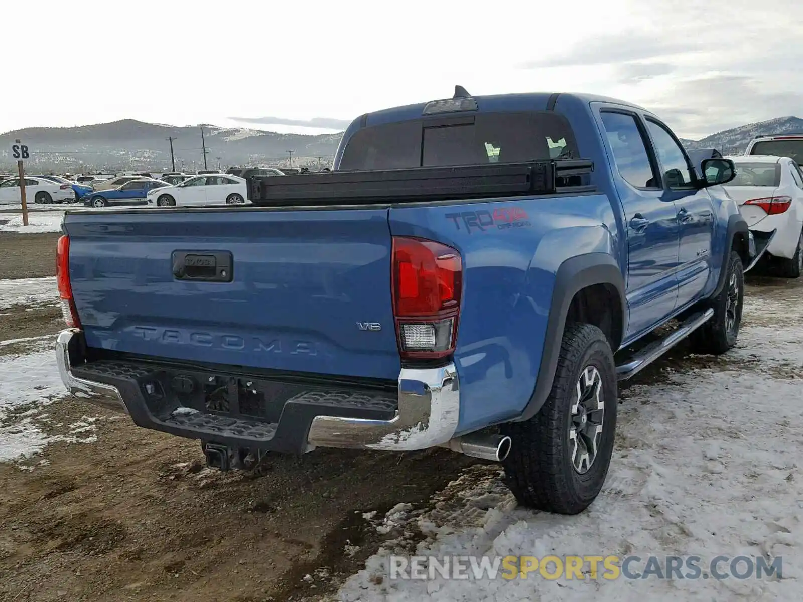 4 Photograph of a damaged car 3TMCZ5AN1KM195469 TOYOTA TACOMA DOU 2019