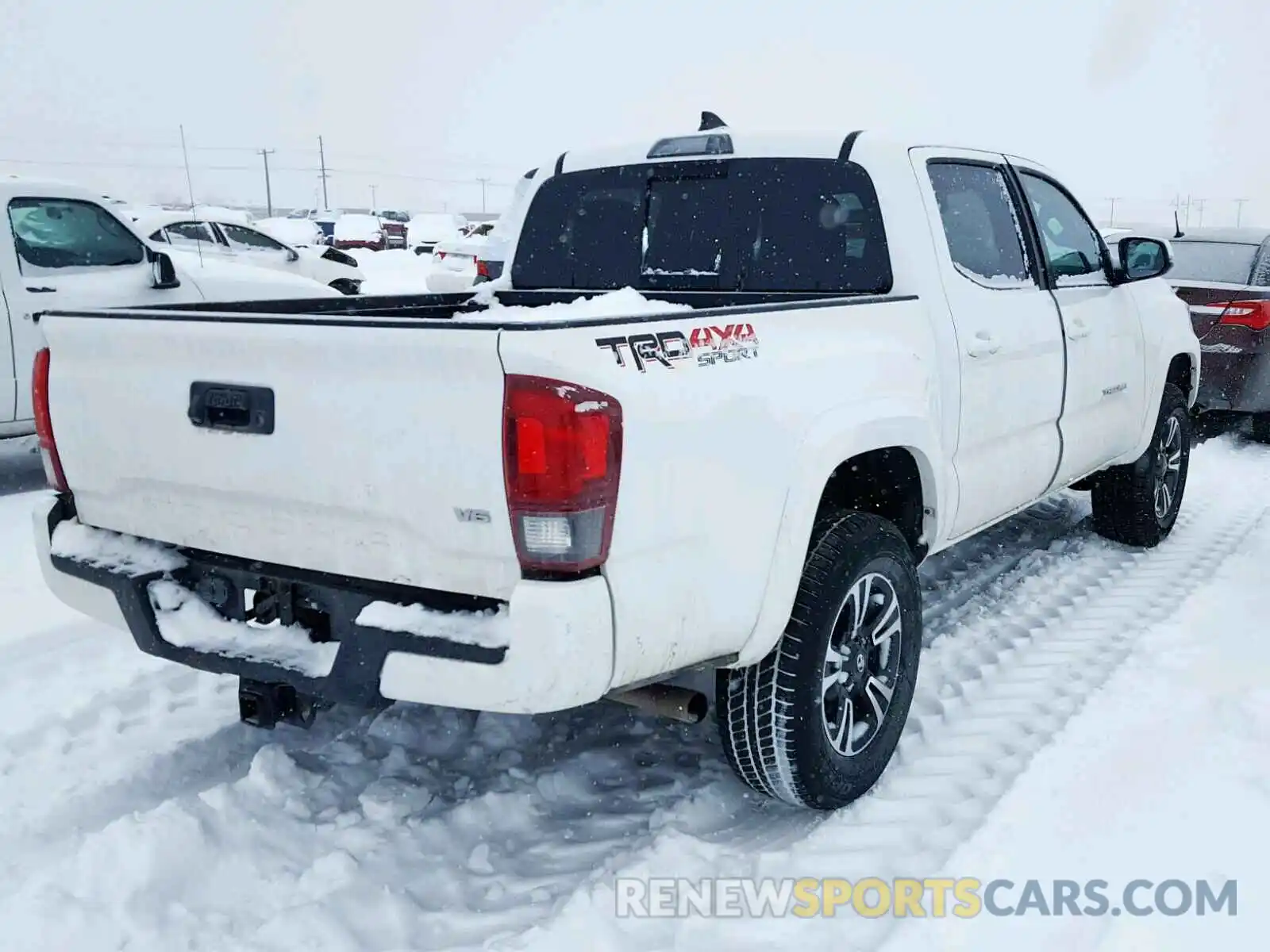 4 Photograph of a damaged car 3TMCZ5AN6KM209477 TOYOTA TACOMA DOU 2019