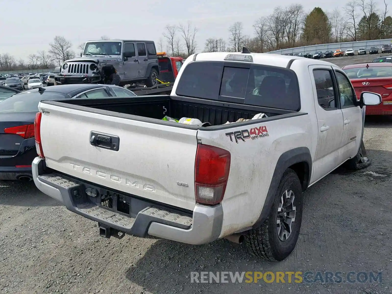 4 Photograph of a damaged car 3TMCZ5ANXKM191453 TOYOTA TACOMA DOU 2019