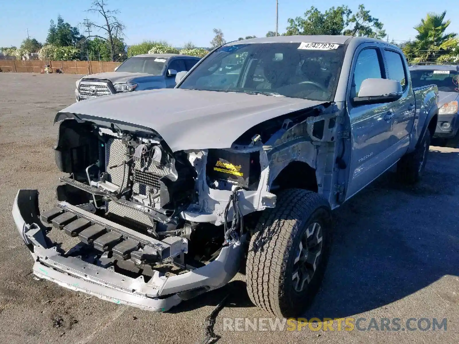 2 Photograph of a damaged car 3TMDZ5BN0KM061880 TOYOTA TACOMA DOU 2019