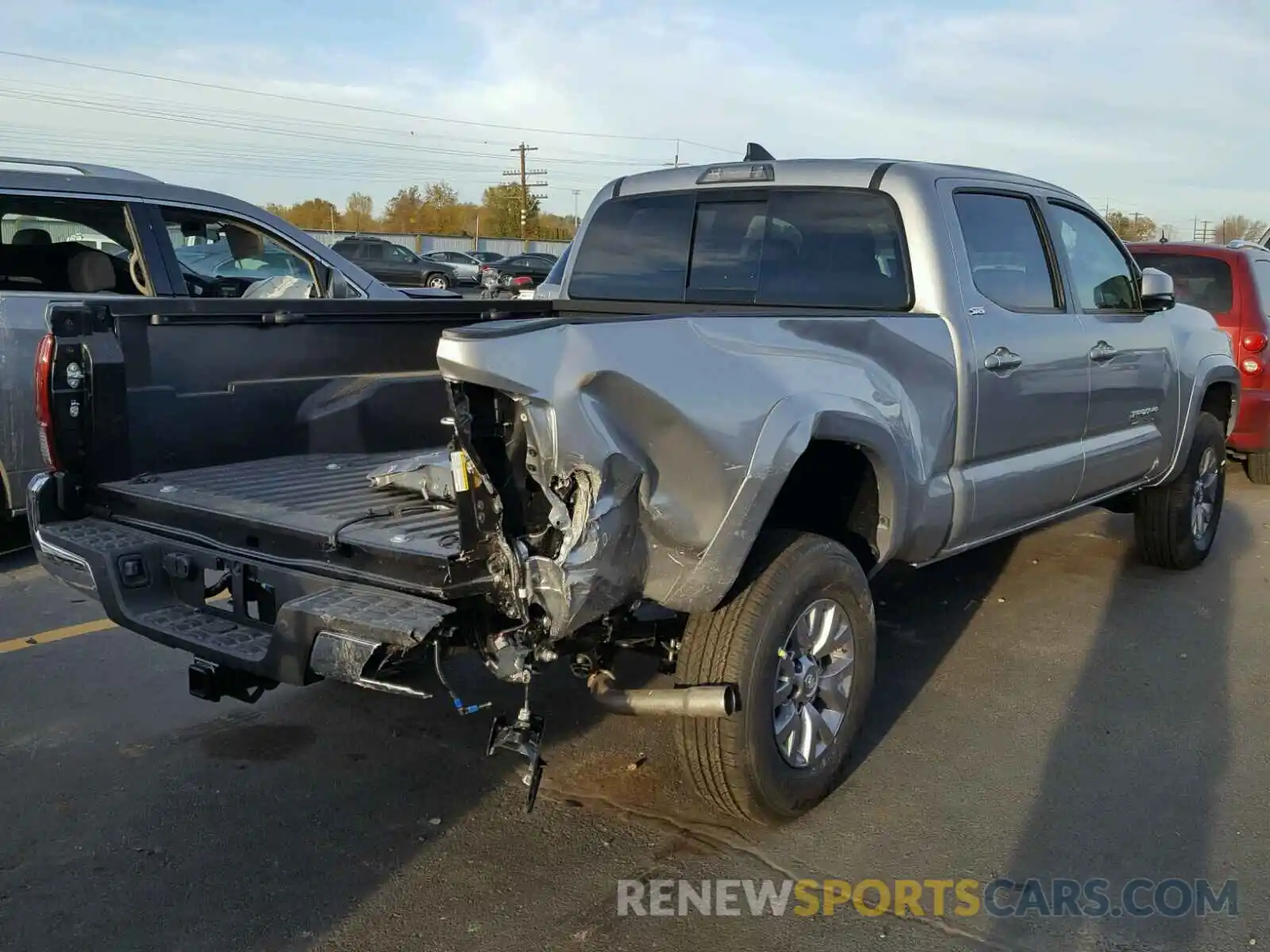 4 Photograph of a damaged car 3TMDZ5BN4KM055824 TOYOTA TACOMA DOU 2019