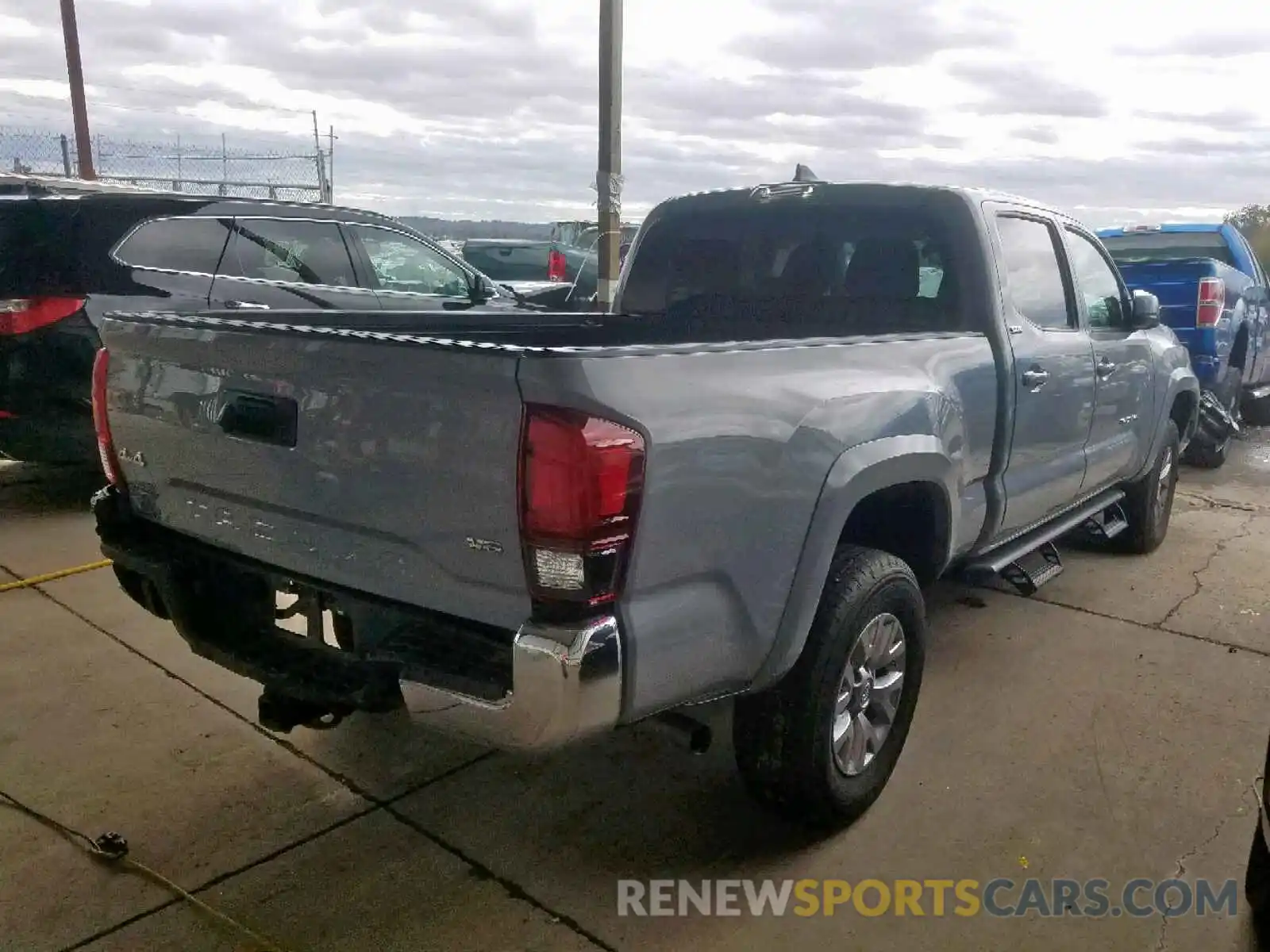 4 Photograph of a damaged car 3TMDZ5BN4KM056536 TOYOTA TACOMA DOU 2019