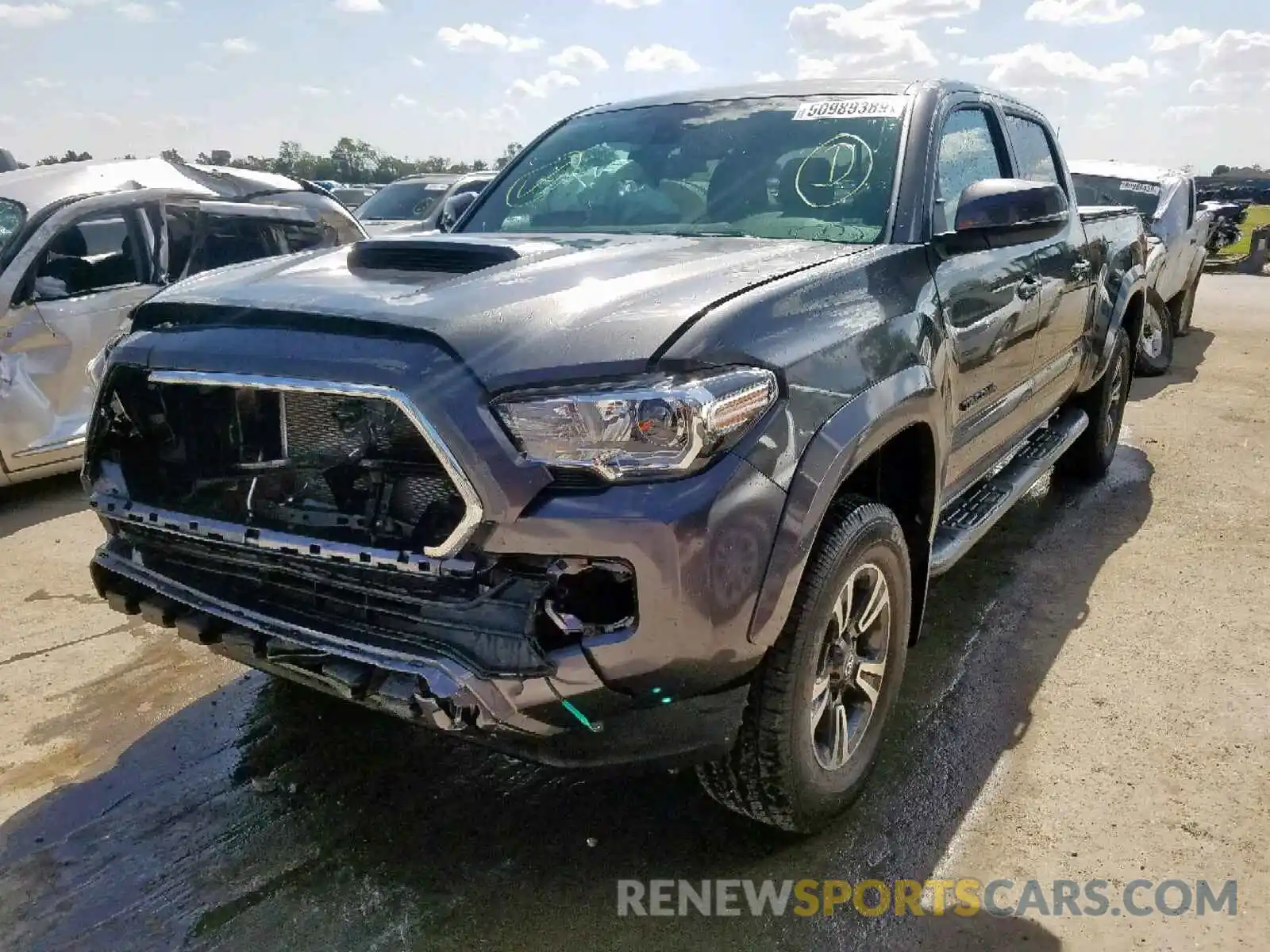 2 Photograph of a damaged car 3TMDZ5BN8KM067703 TOYOTA TACOMA DOU 2019